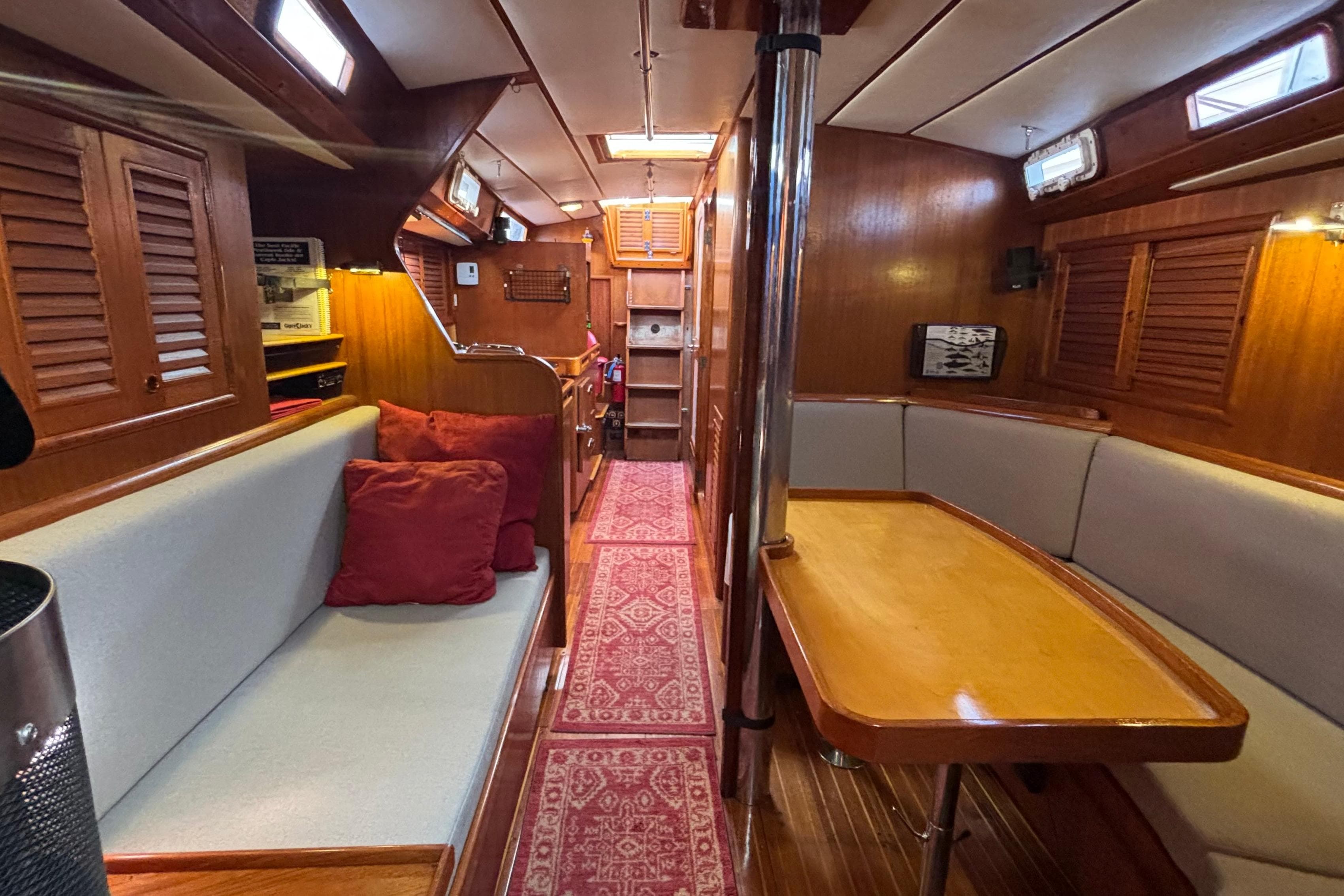 Golden Wave 42 "Argonauta" - Aft View Main Salon to Companionway Stairs & Hatch. Burmese Teak Entire Cabin.