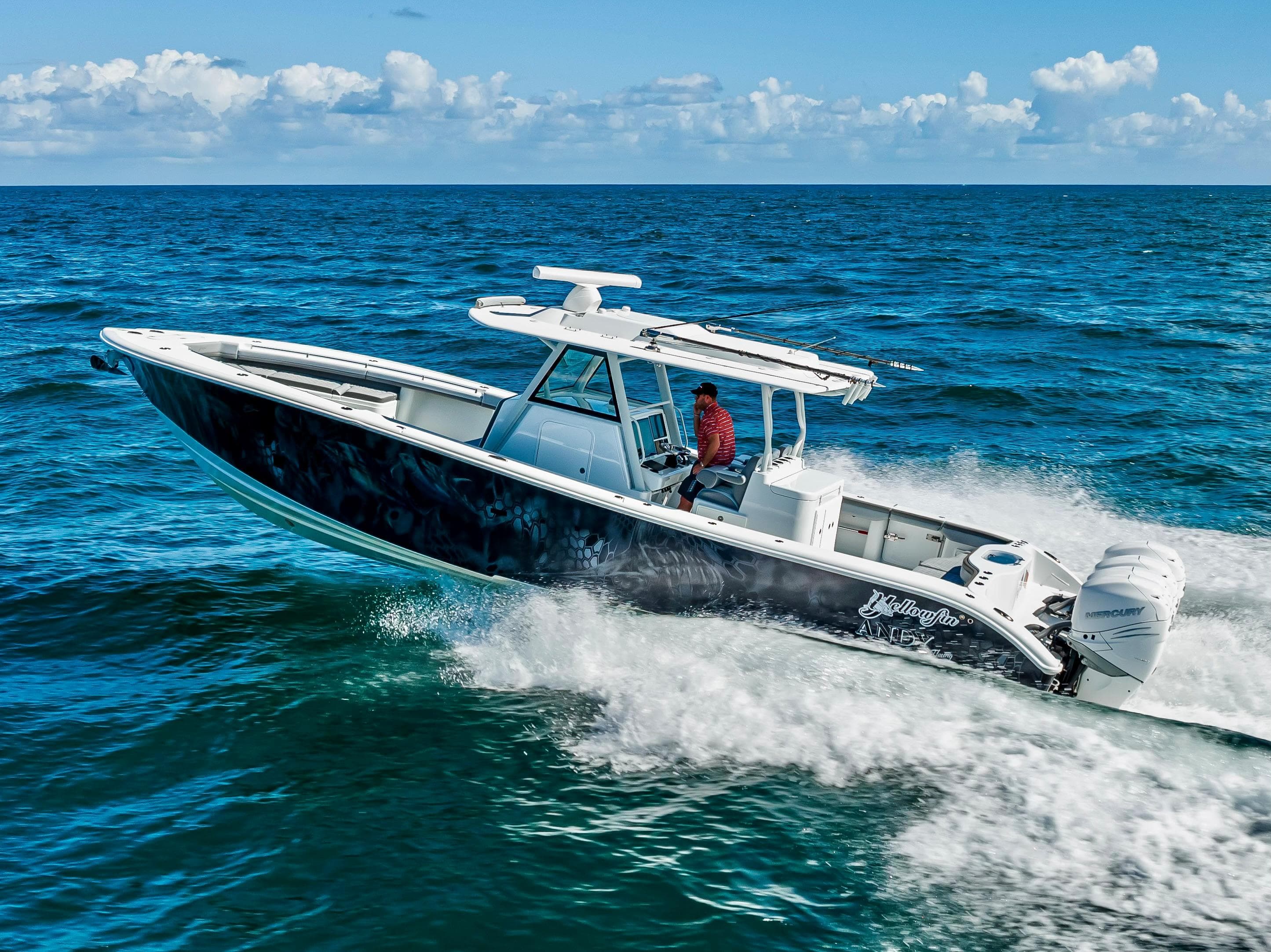 2021 Yellowfin 39 boat cruising on open ocean under clear skies.
