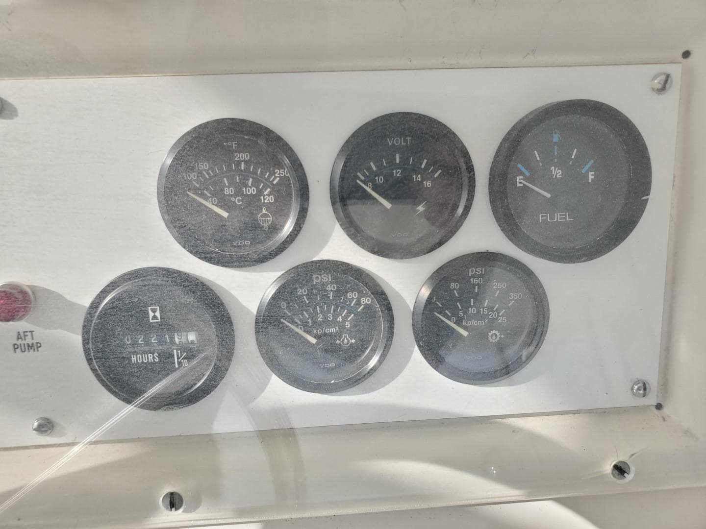 Dashboard gauges of a 1988 Post 46 Sportfish boat, showing various engine metrics.