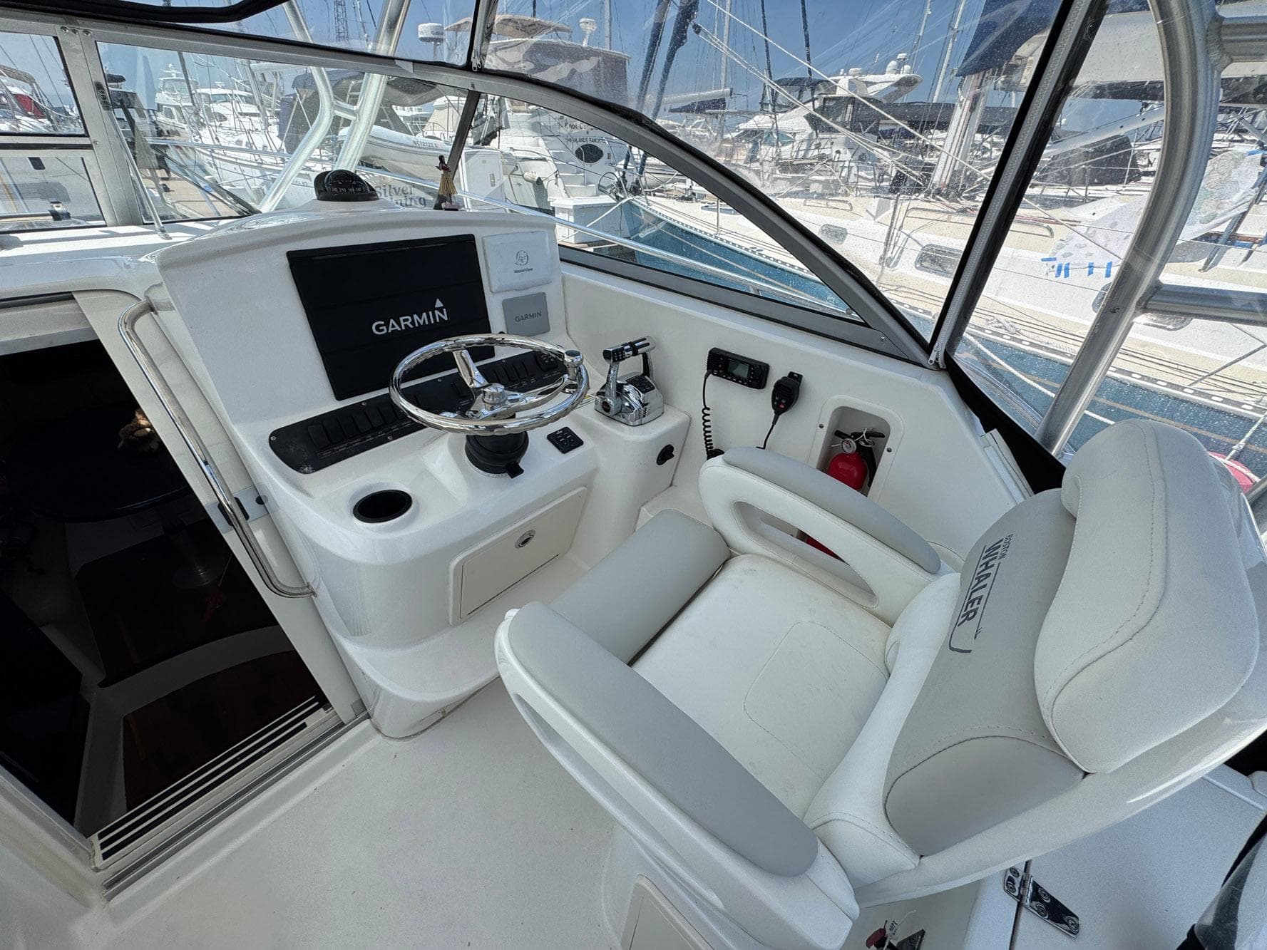 Helm of 2011 Boston Whaler 305 Conquest with Garmin navigation system.