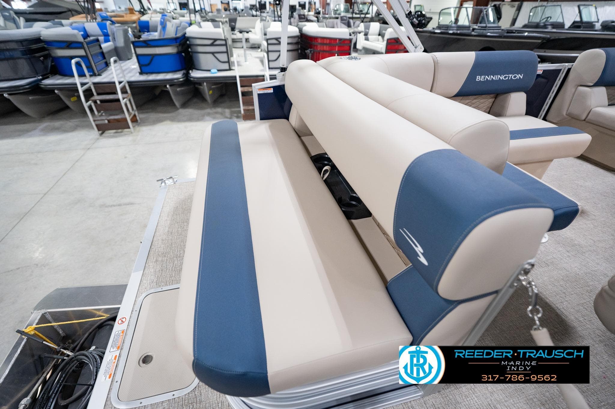 2026 Bennington 168 SLJ pontoon boat interior with beige and blue seating at Reeder-Trausch Marine.