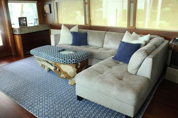 Luxurious interior of 1983 Cheoy Lee 90 cockpit motor yacht with plush seating.