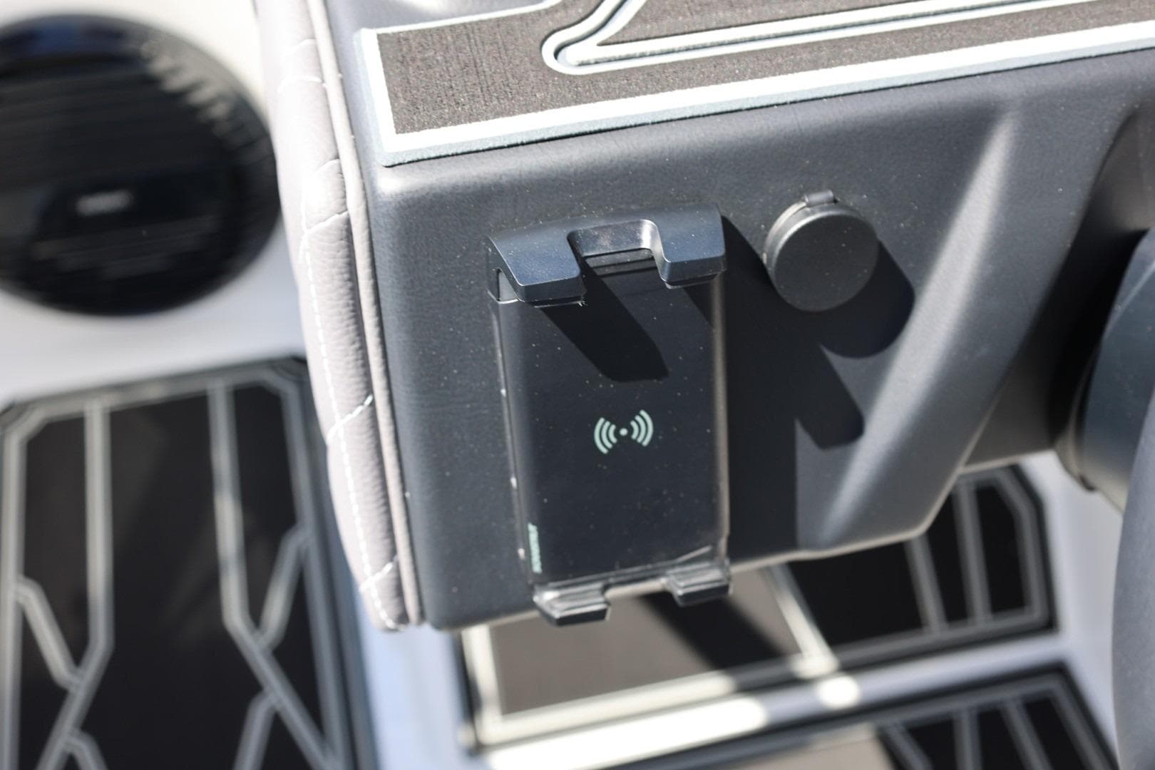 Dashboard of 2026 Tigé Z3 boat featuring a wireless charging pad.