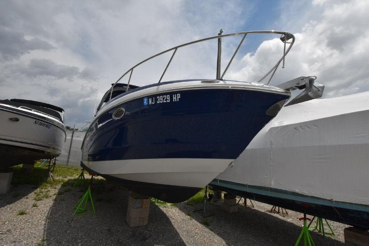 2021 Crownline 264 CR boat on stands, front view.