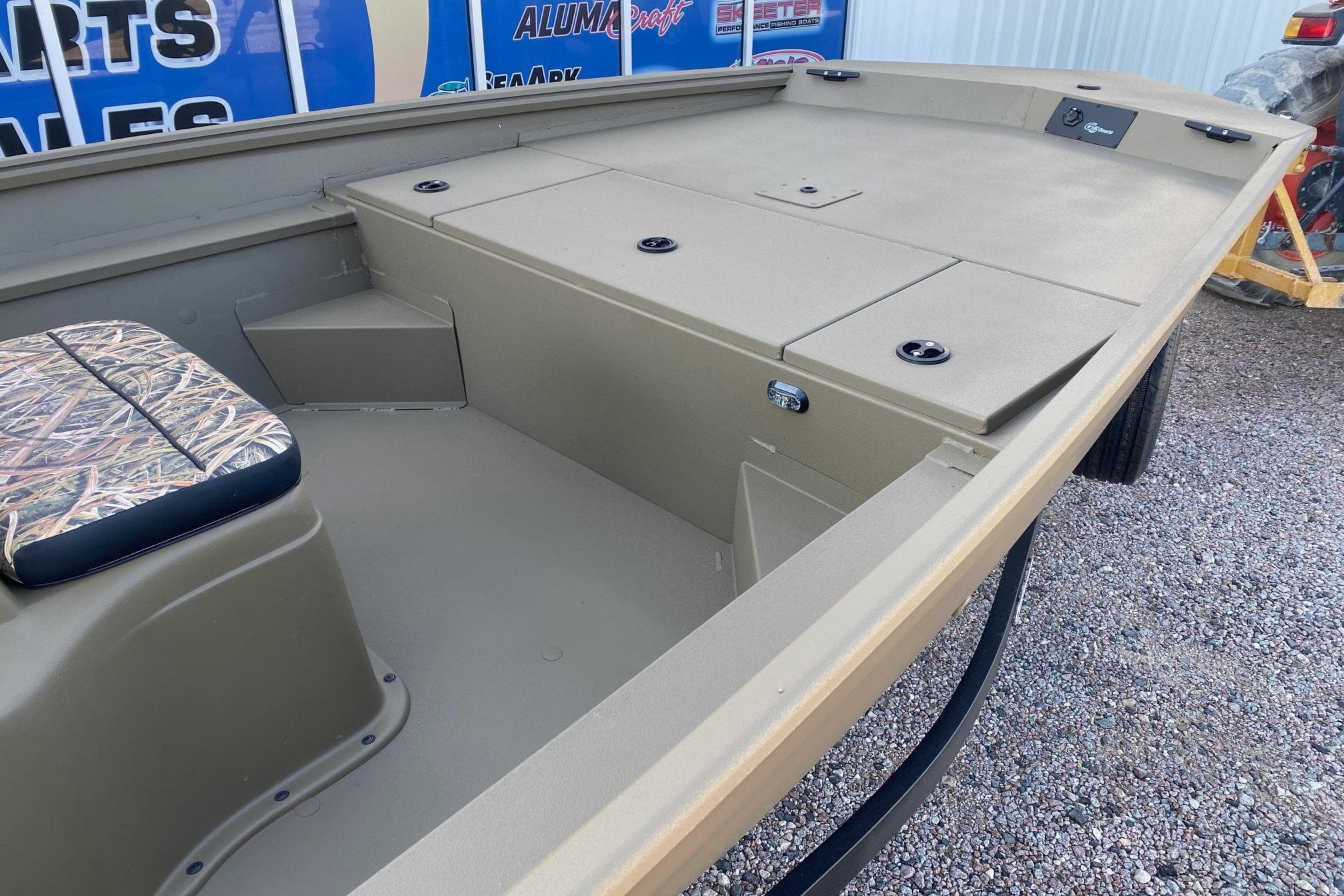 2026 G3 Gator Tough 18 CC boat interior with camo seat and storage compartments.