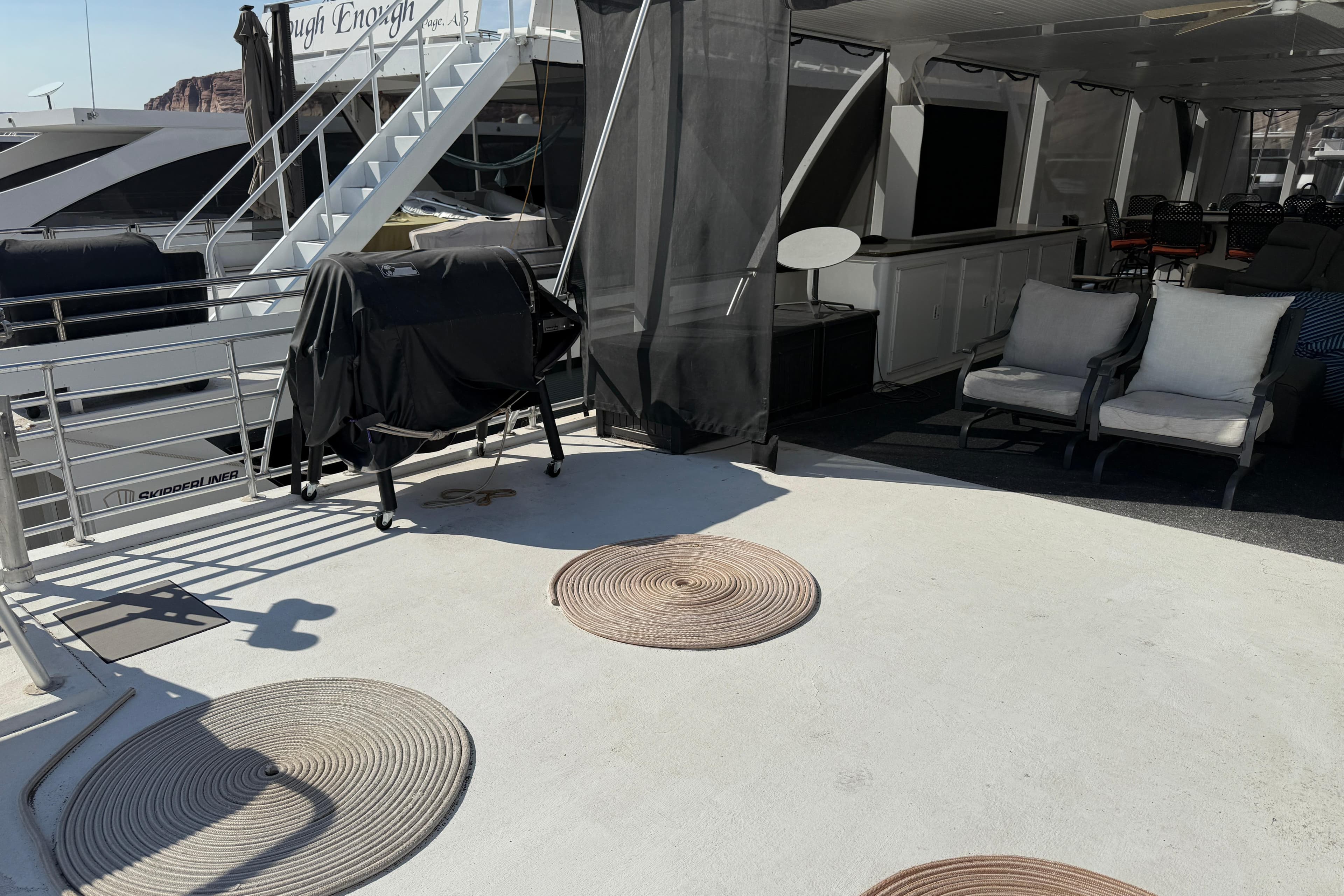 Luxury yacht deck with seating, grill, and spiral mats, STARDUST Oceans Share #2, 2015 model.