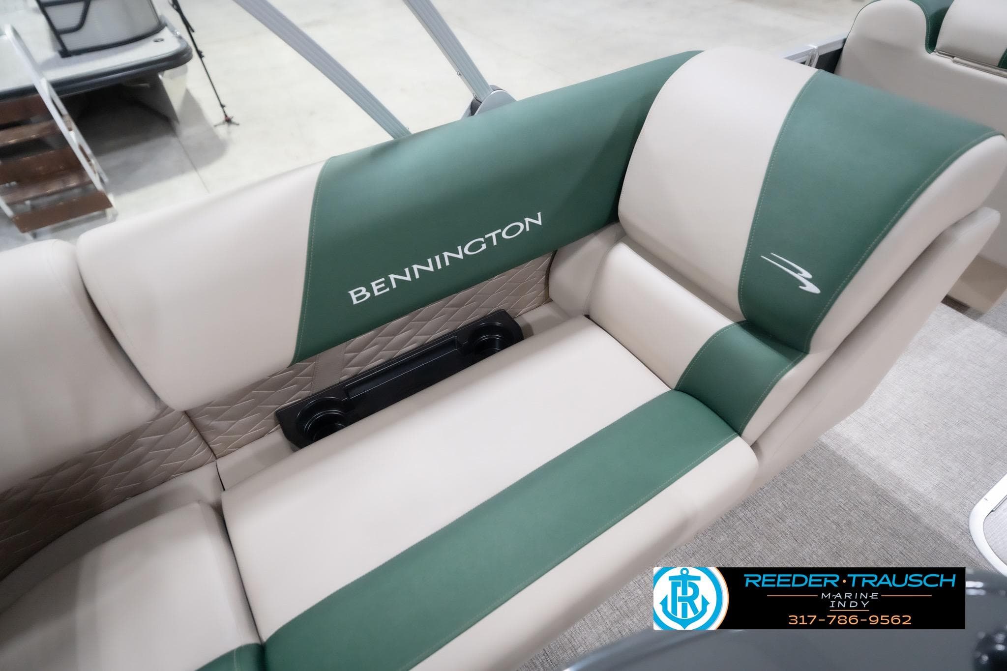 2026 Bennington 20 SLJ boat seat with green and beige upholstery, featuring logo details.