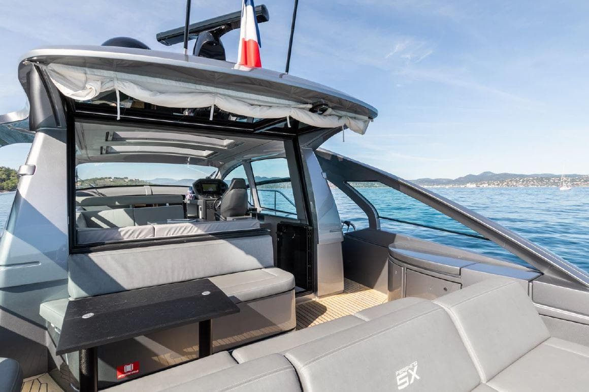 Luxurious 2018 Pershing 5x yacht with sleek design and spacious deck on open water.