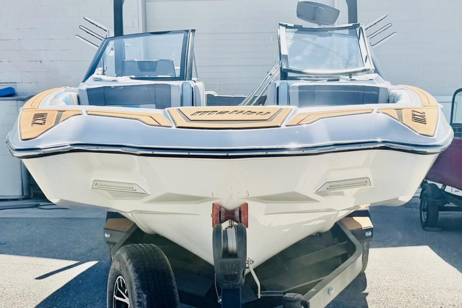 2021 Malibu Wakesetter 23 MXZ boat on trailer, front view.