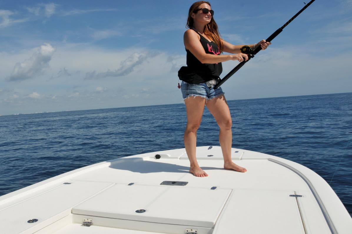 Manufacturer Provided Image: Woman fishing on a 2025 Sea Born FX24 Bay boat in open water.