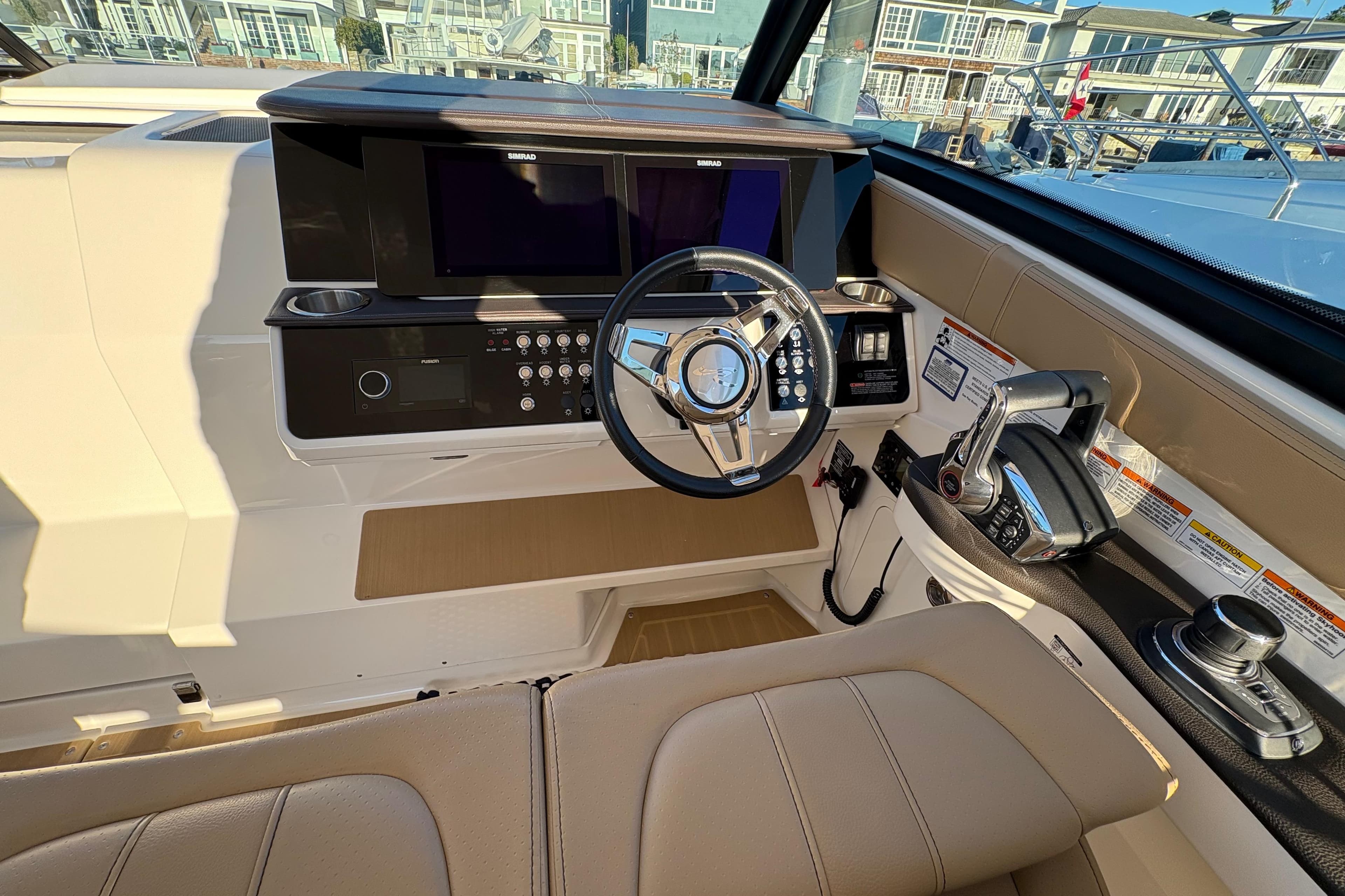 2022 Sea Ray Sundancer 320 helm with modern controls and dual displays.