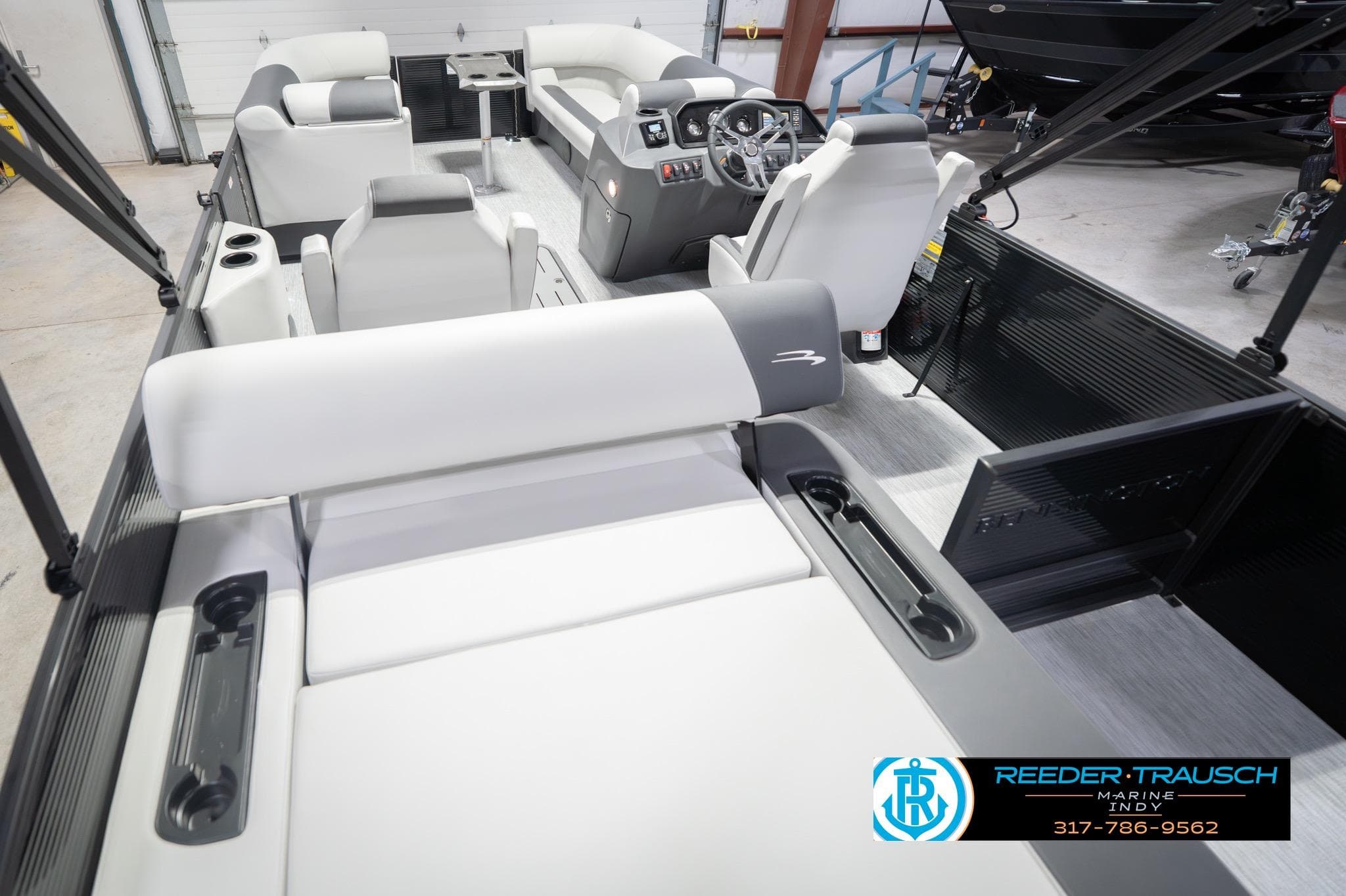 2026 Bennington 22 SSB pontoon boat interior with modern seating and steering console.