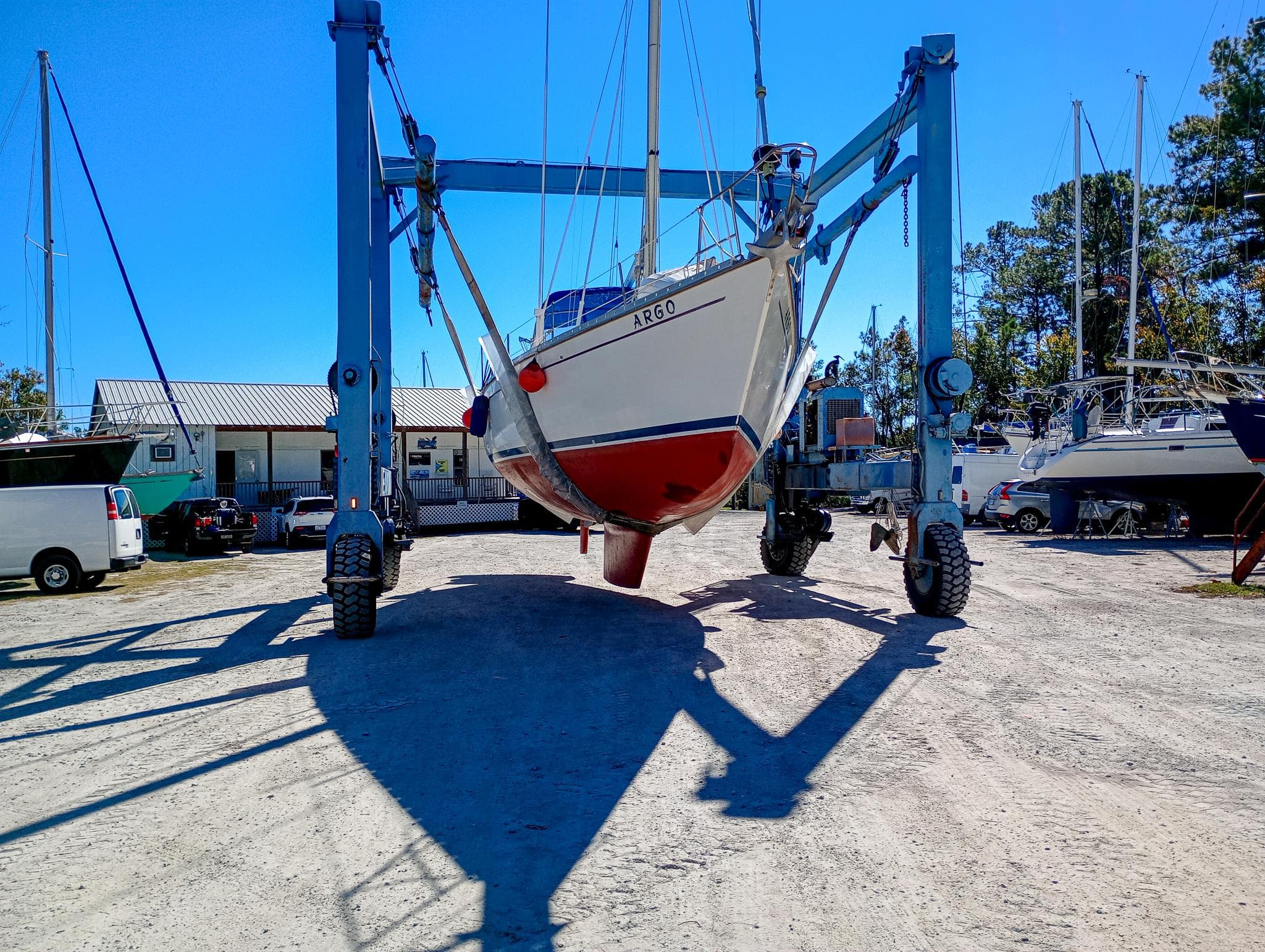 1989 Morgan 44 Center Cockpit sailboat in dry dock, supported by a boat lift.
