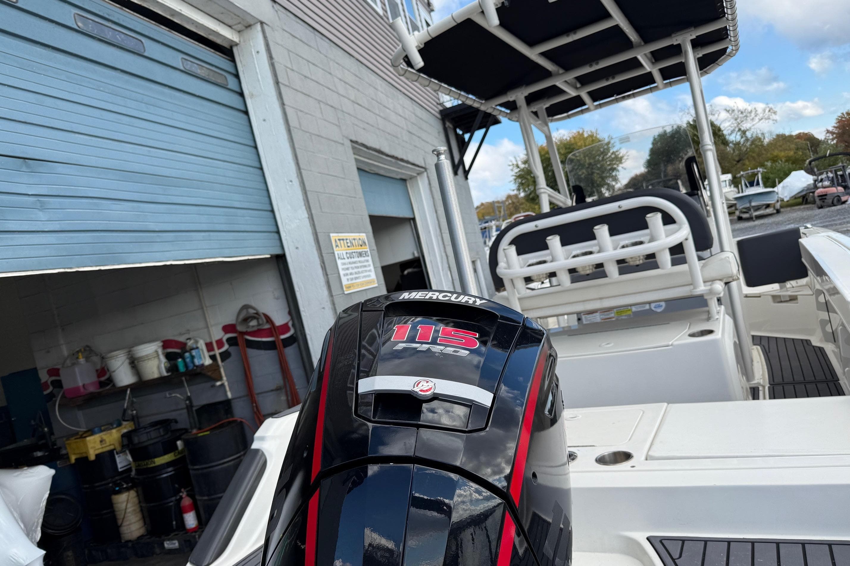 2023 Bayliner Trophy T20CC boat with Mercury 115 engine at a marina.