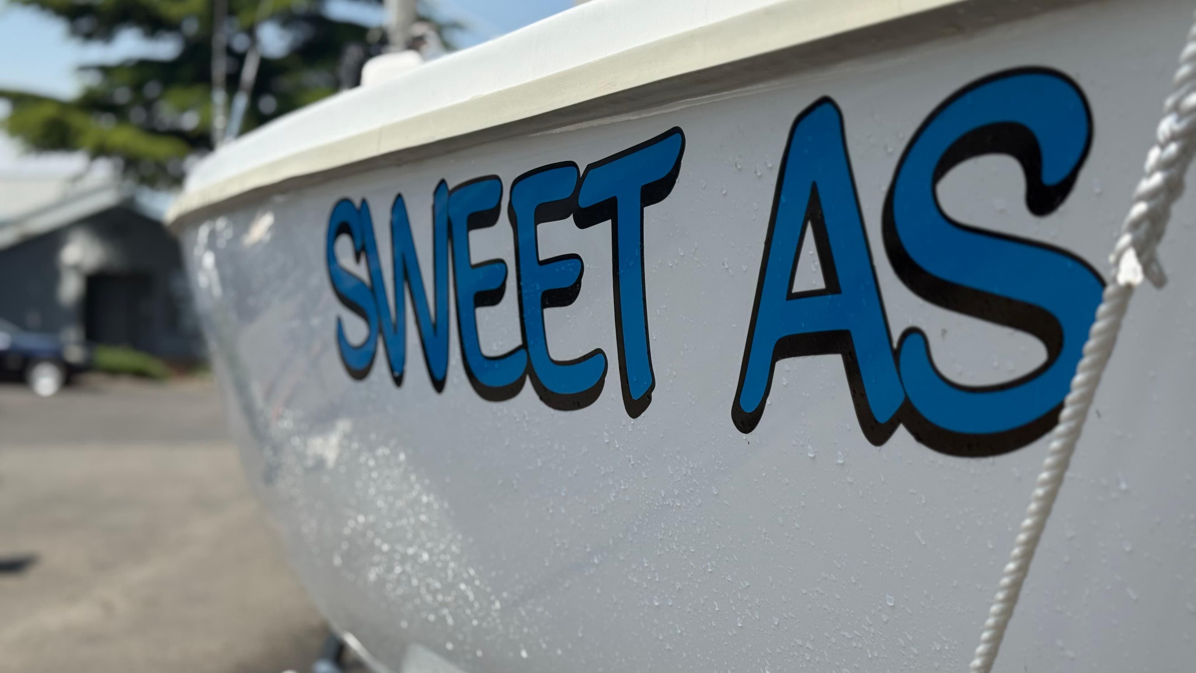 Marlow-Hunter 22 sailboat with "Sweet As" text on hull, 2011 model.