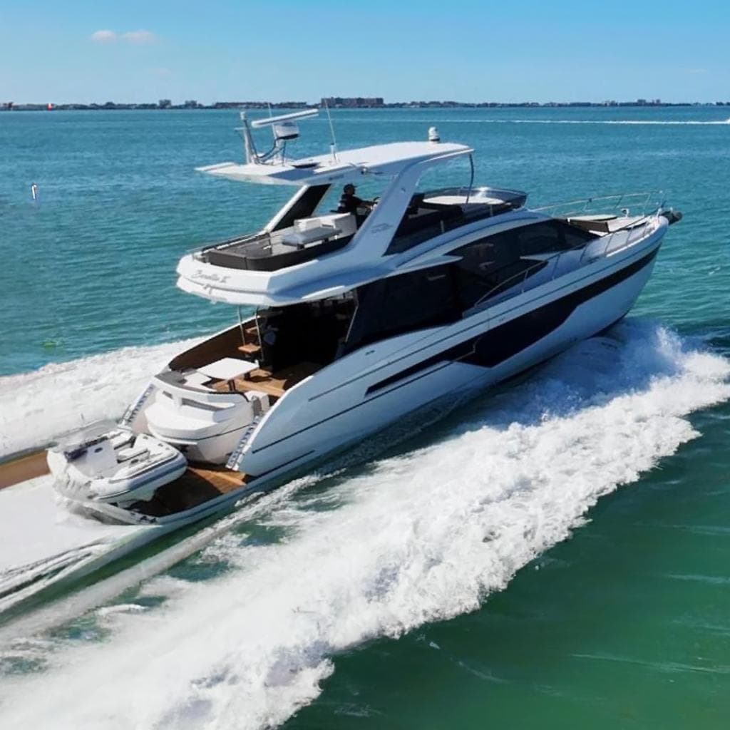 2022 Galeon 500 Fly yacht cruising on clear blue ocean waters.
