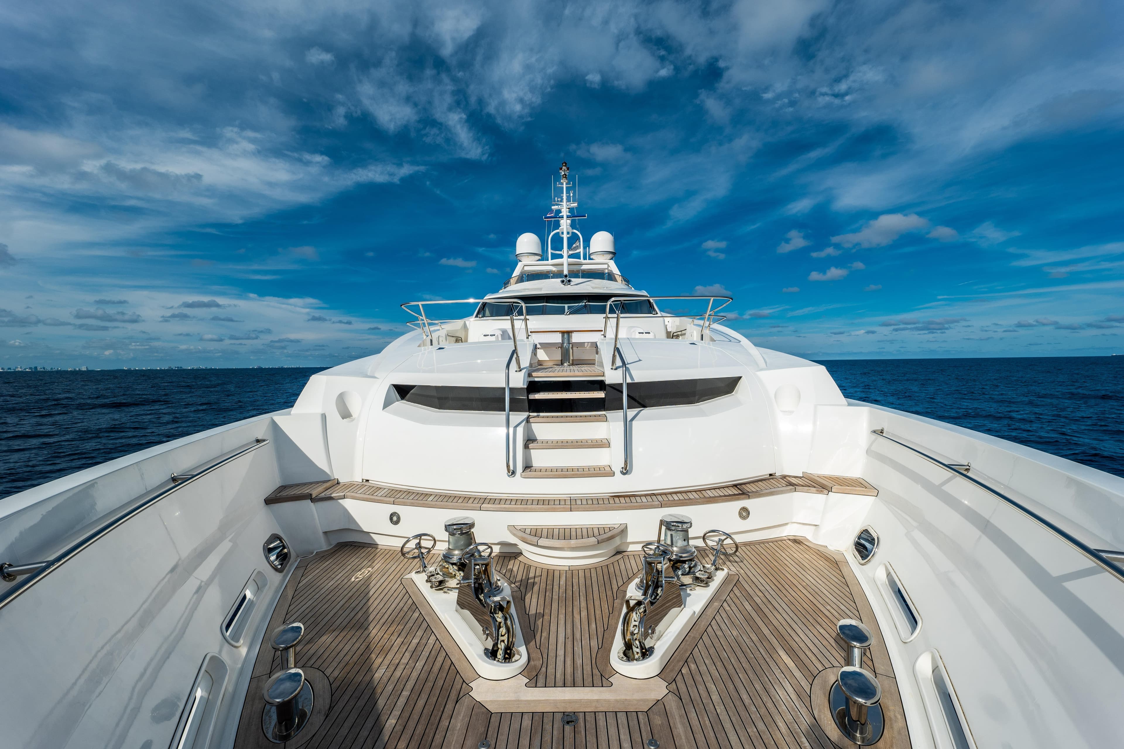 Luxurious 2010 Sunseeker 40 Metre Yacht on open sea under blue sky.