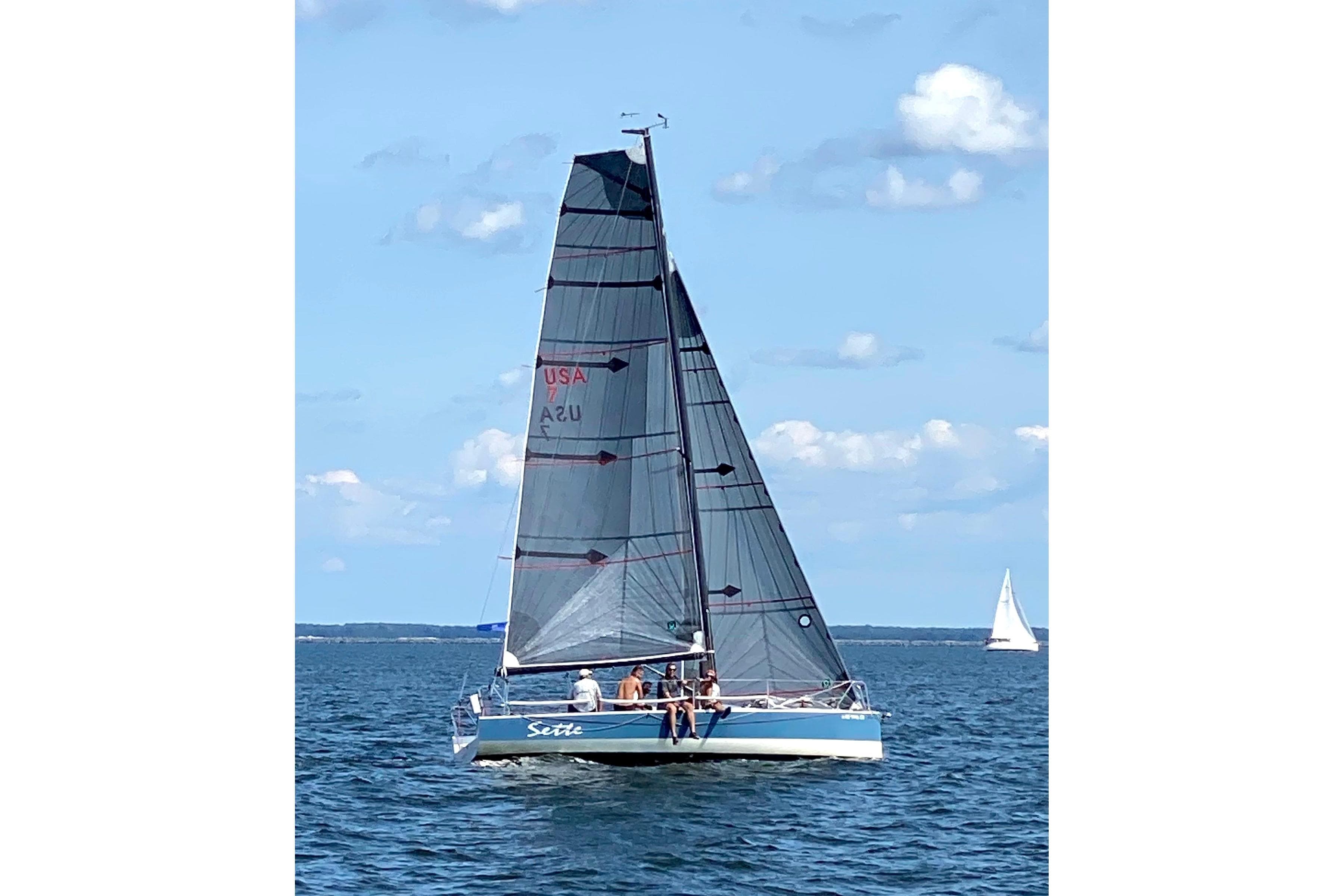 Sailboat Wraceboats GP26 2015 on open water under clear blue sky.