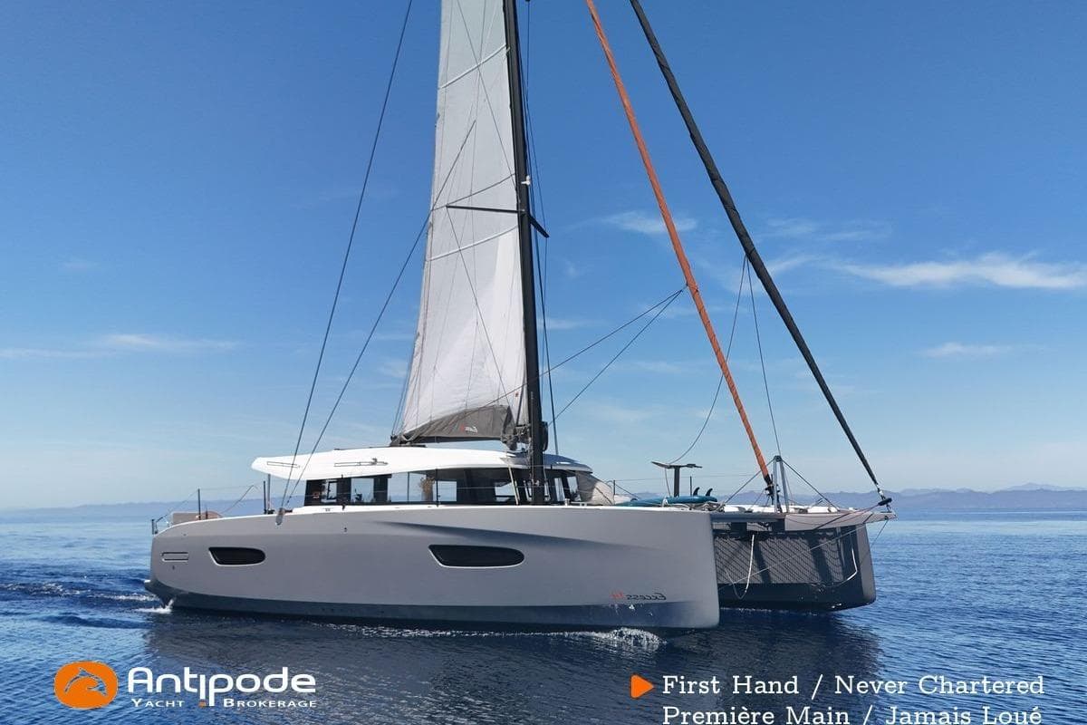 2023 Excess 14 catamaran sailing on calm sea, first-hand, never chartered.
