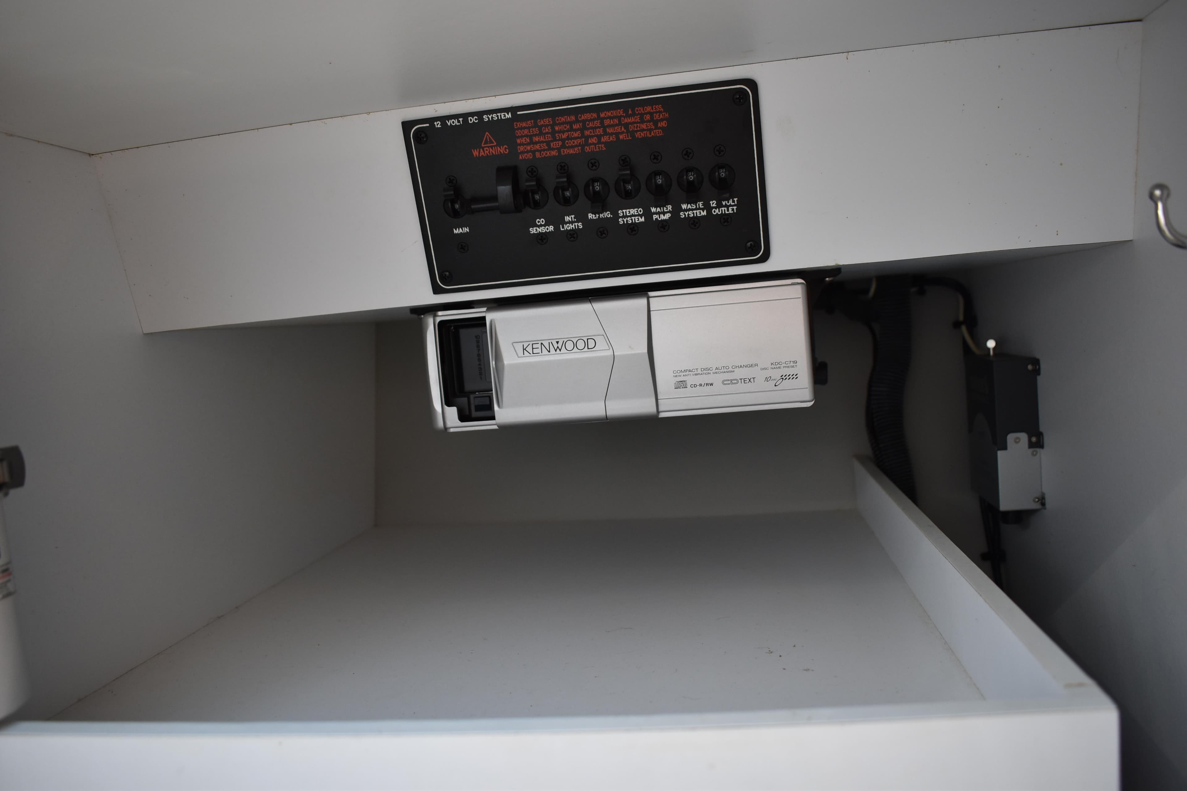 2008 Formula 353 FASTech interior compartment with control panel and Kenwood audio system.