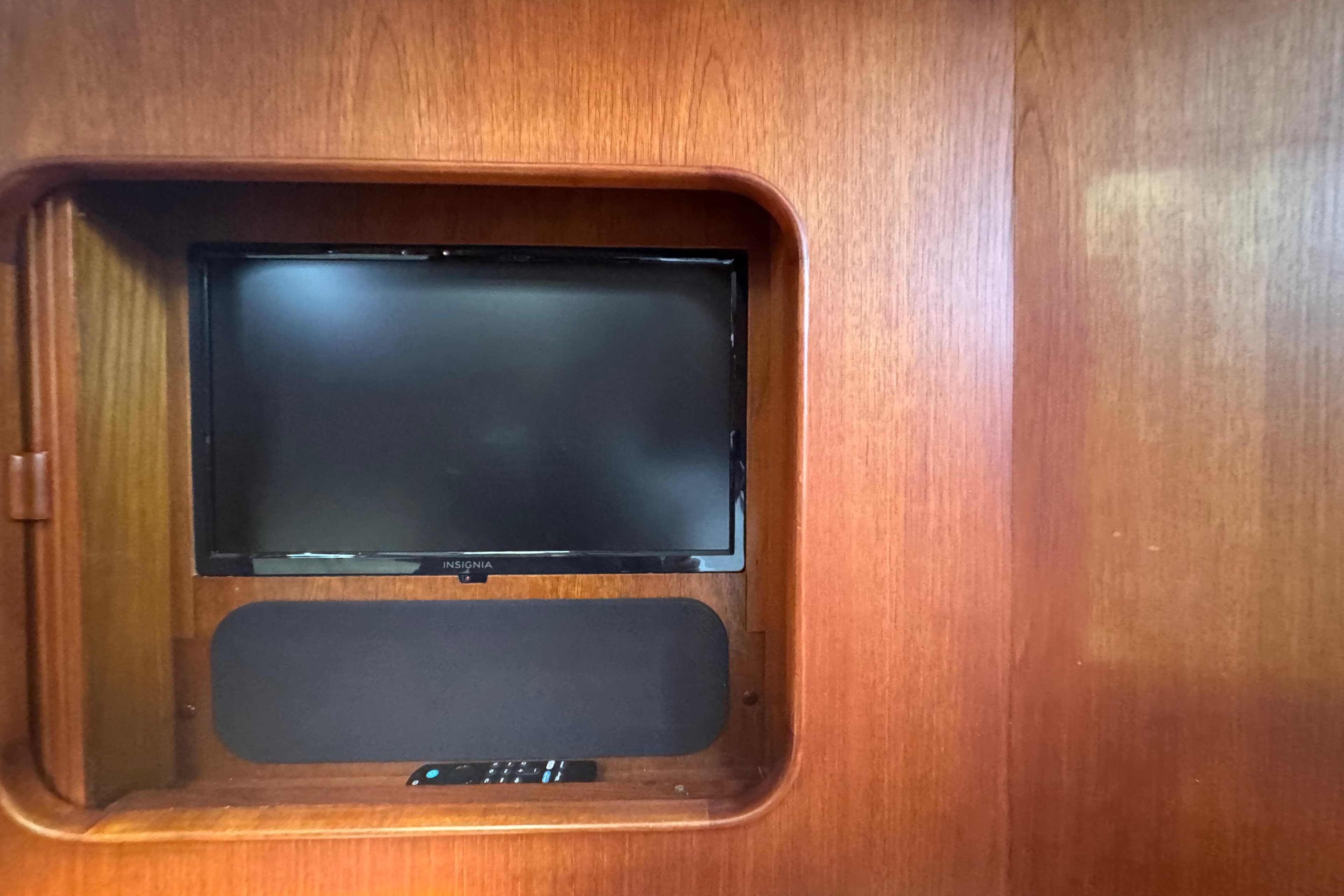 Built-in TV and speaker on 1989 Little Harbor Sloop 58' wooden interior.