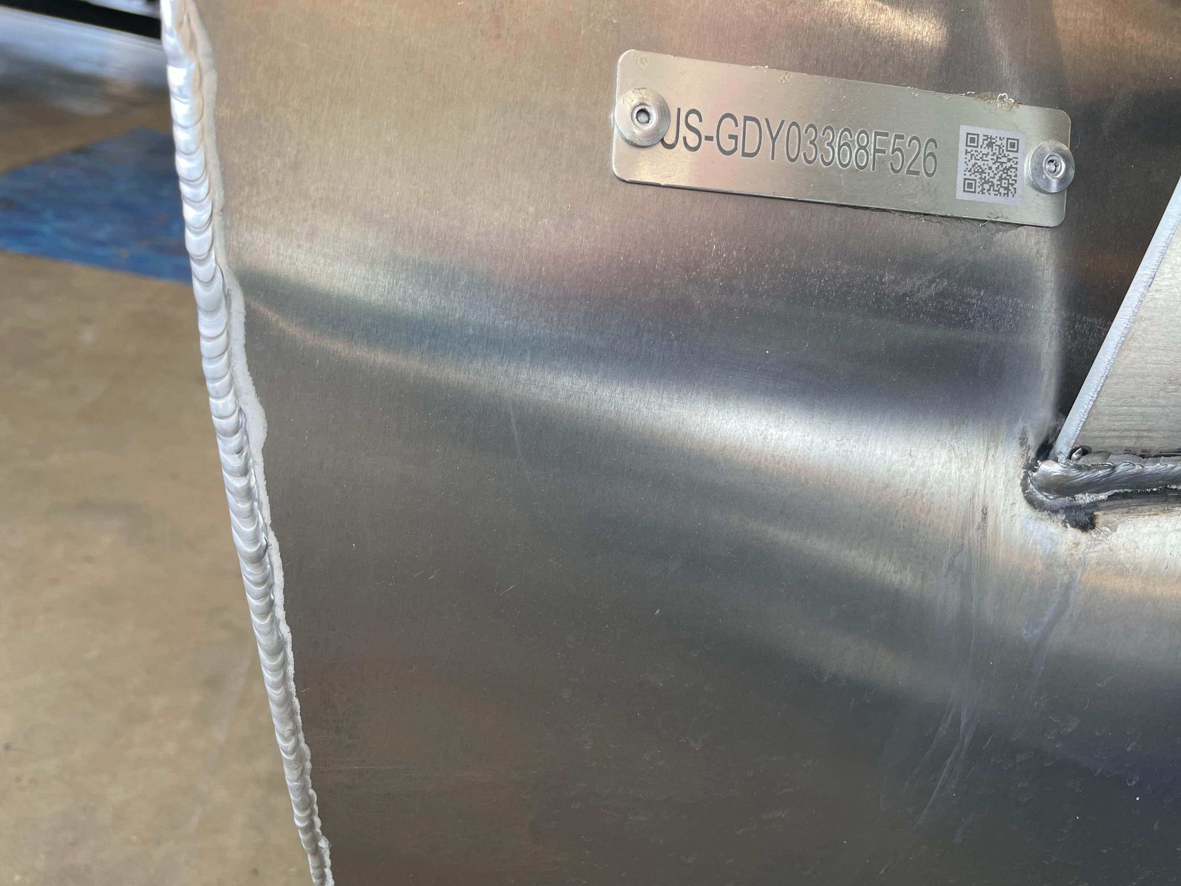 Metallic surface with a serial number plate on a 2026 Godfrey Xperience 2086 CX.