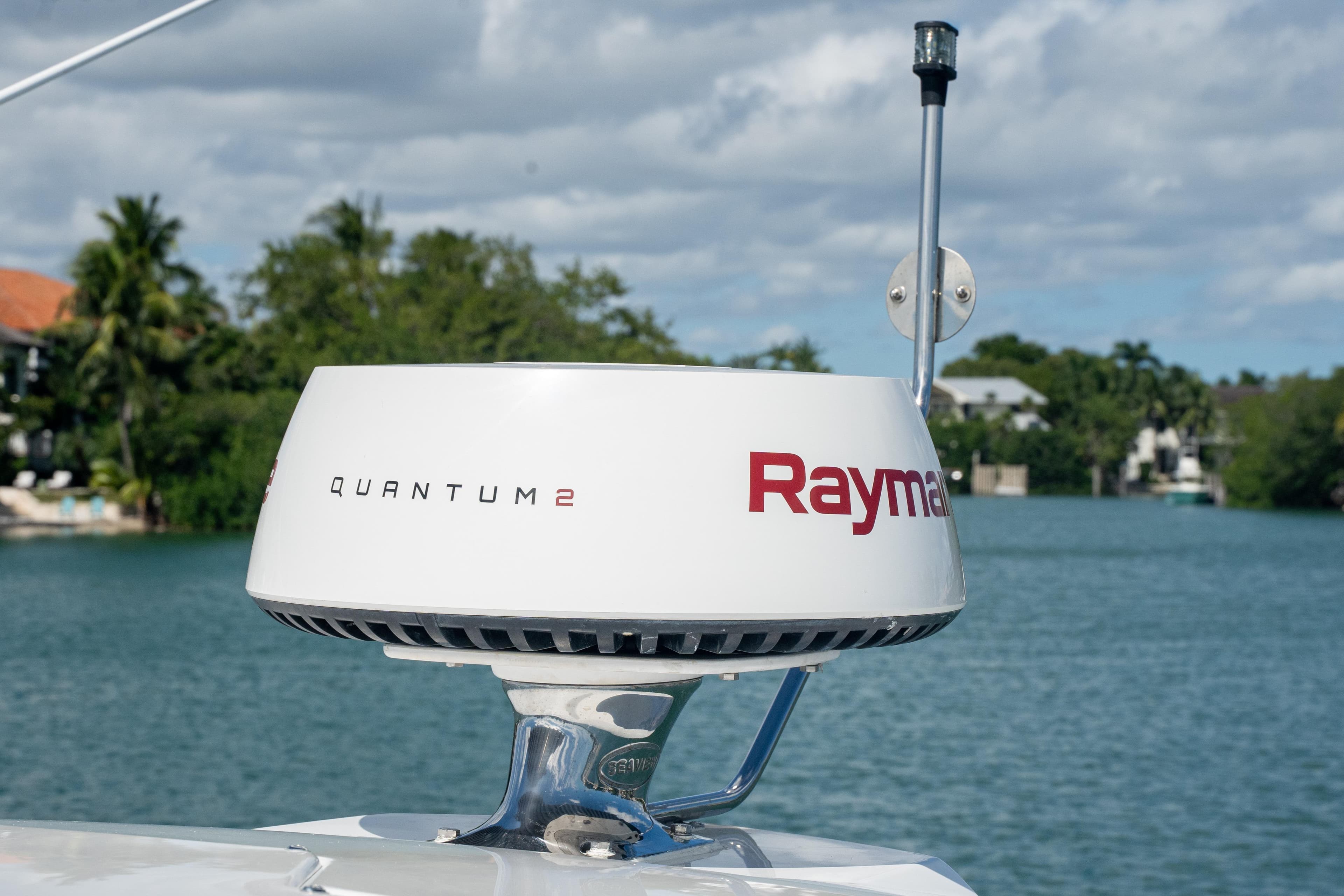 Raymarine Quantum 2 radar on 2018 Cruisers Yachts 390 Express Coupe, with scenic water backdrop.