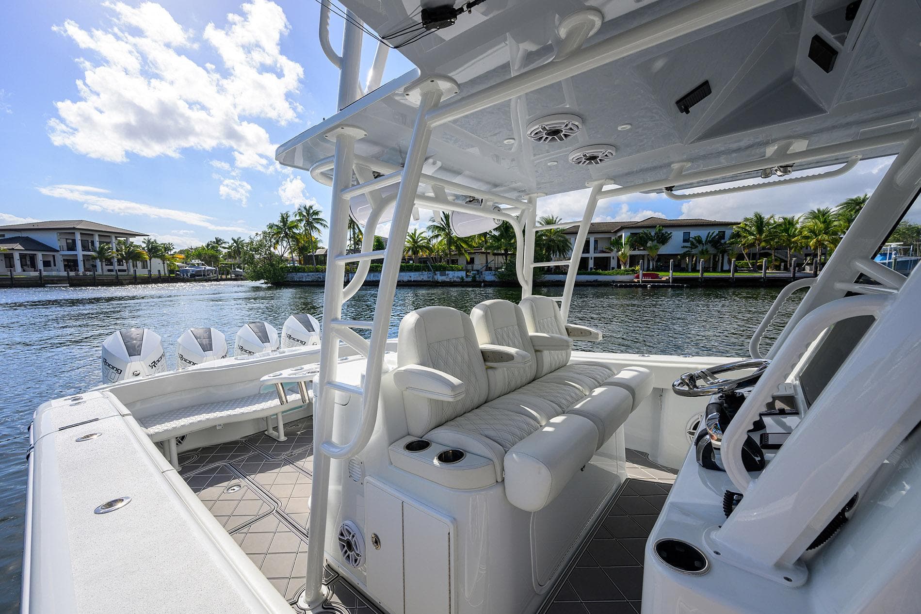 2021 Yellowfin 42 boat interior with luxurious seating and modern design on a sunny waterfront.