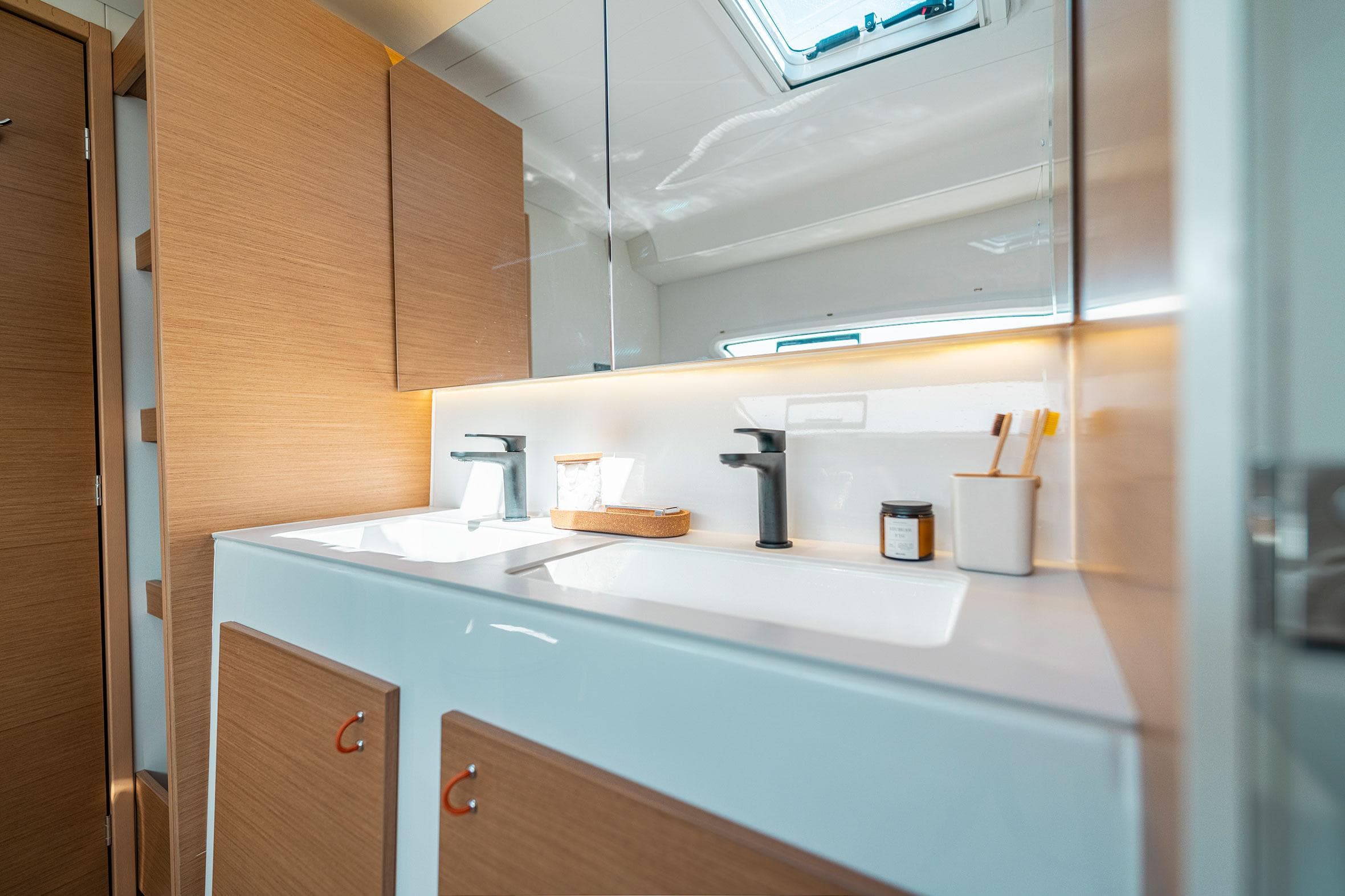Modern bathroom interior in 2026 Excess 13 yacht, featuring sleek fixtures and wooden cabinetry.