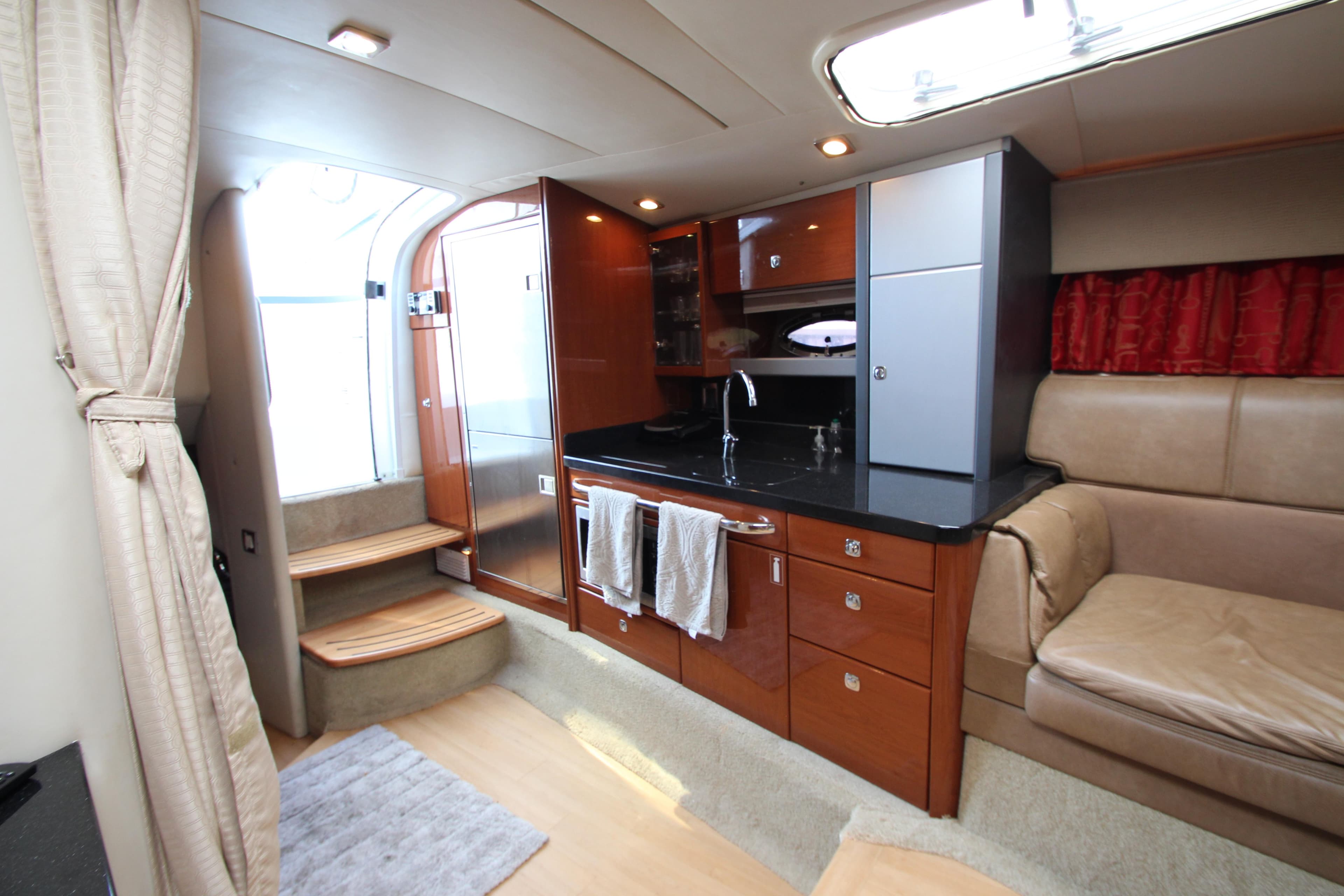 Interior of a 2012 Formula 400 Super Sport yacht with modern kitchen and seating area.