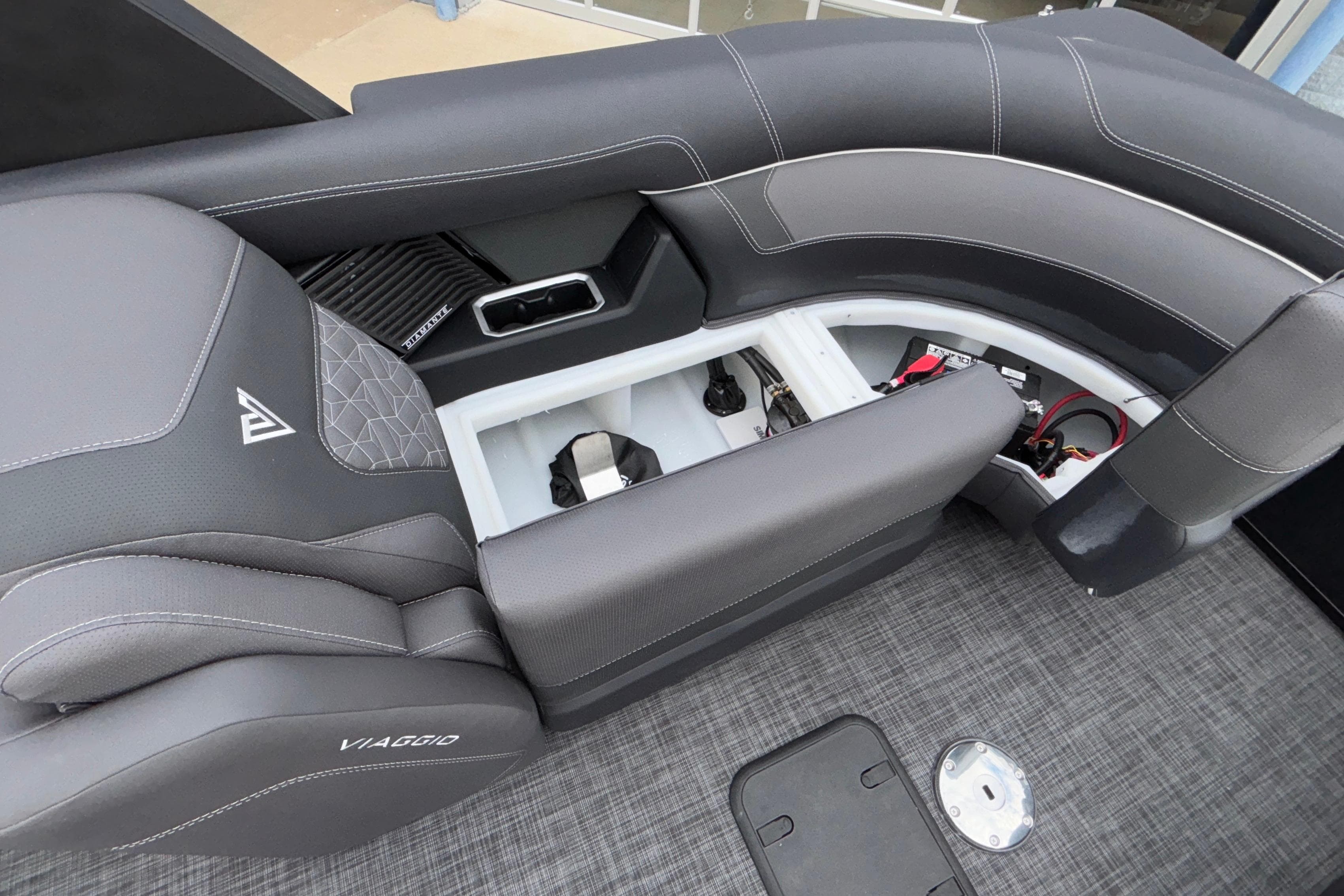 2026 Viaggio D28UW A-T boat interior with open storage compartments and sleek seating design.