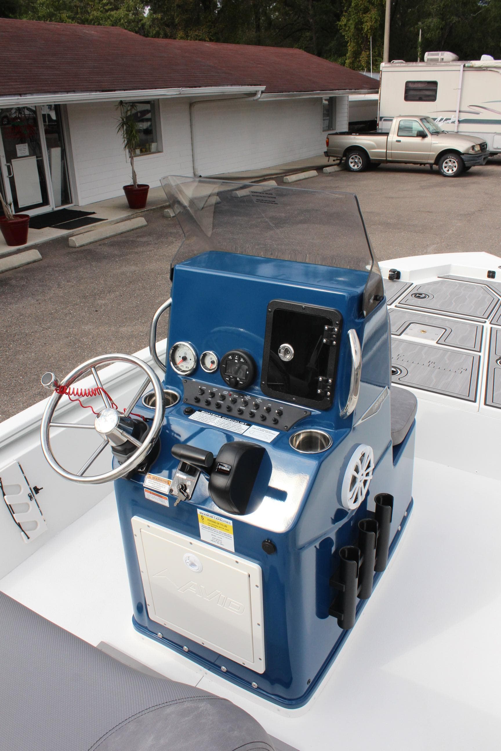2025 Avid 19 FSX boat console with steering wheel and gauges.