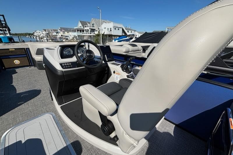 2026 Barletta C24M boat interior with modern helm and luxurious seating.