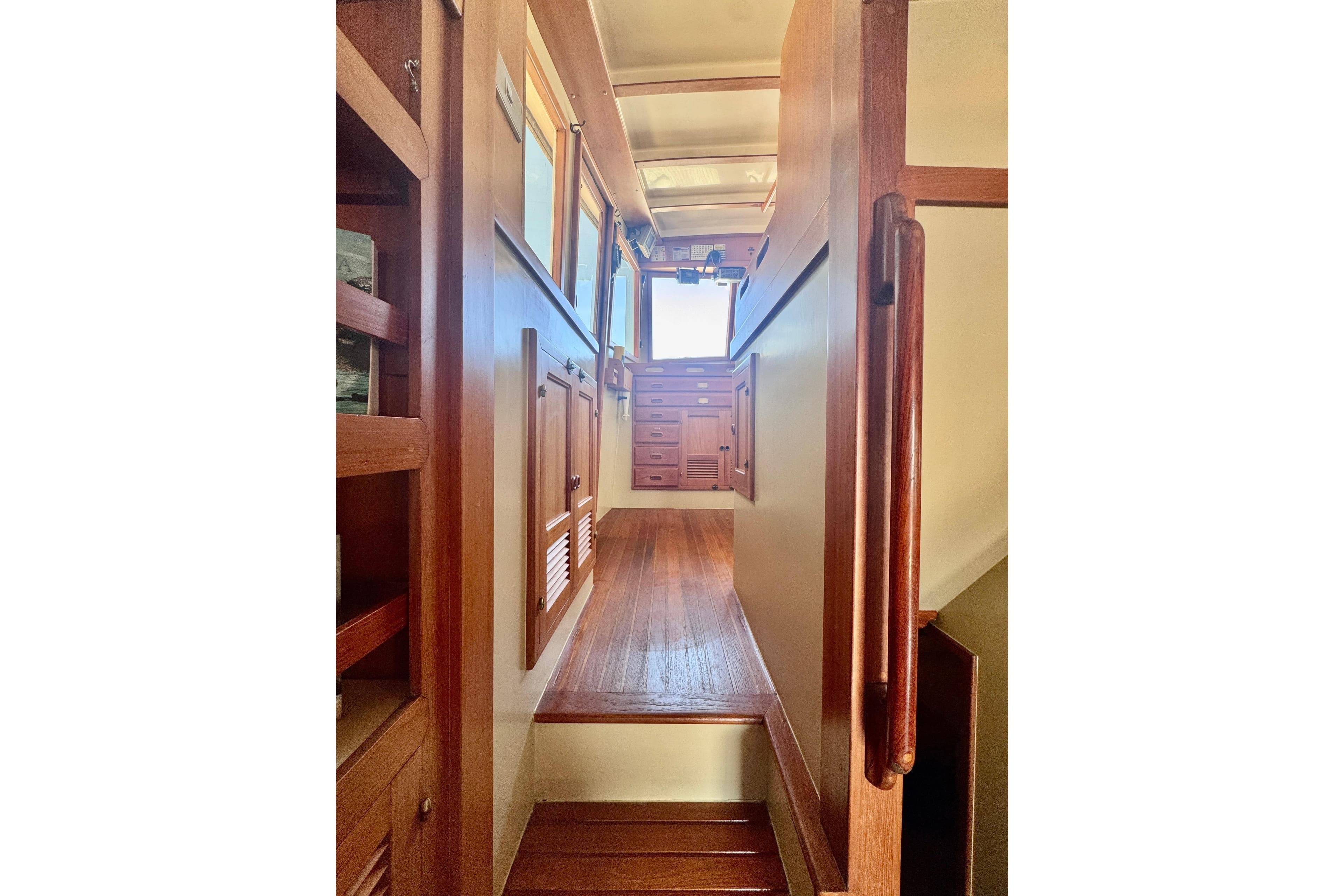 Interior view of 1986 Kadey-Krogen 42 yacht, featuring wooden cabinetry and flooring.