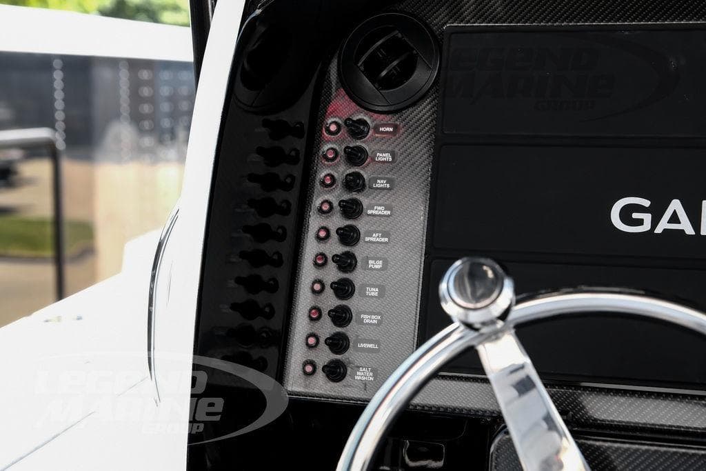 Dashboard of 2024 Nor-Tech 392 Super Fish with Garmin display and control switches.