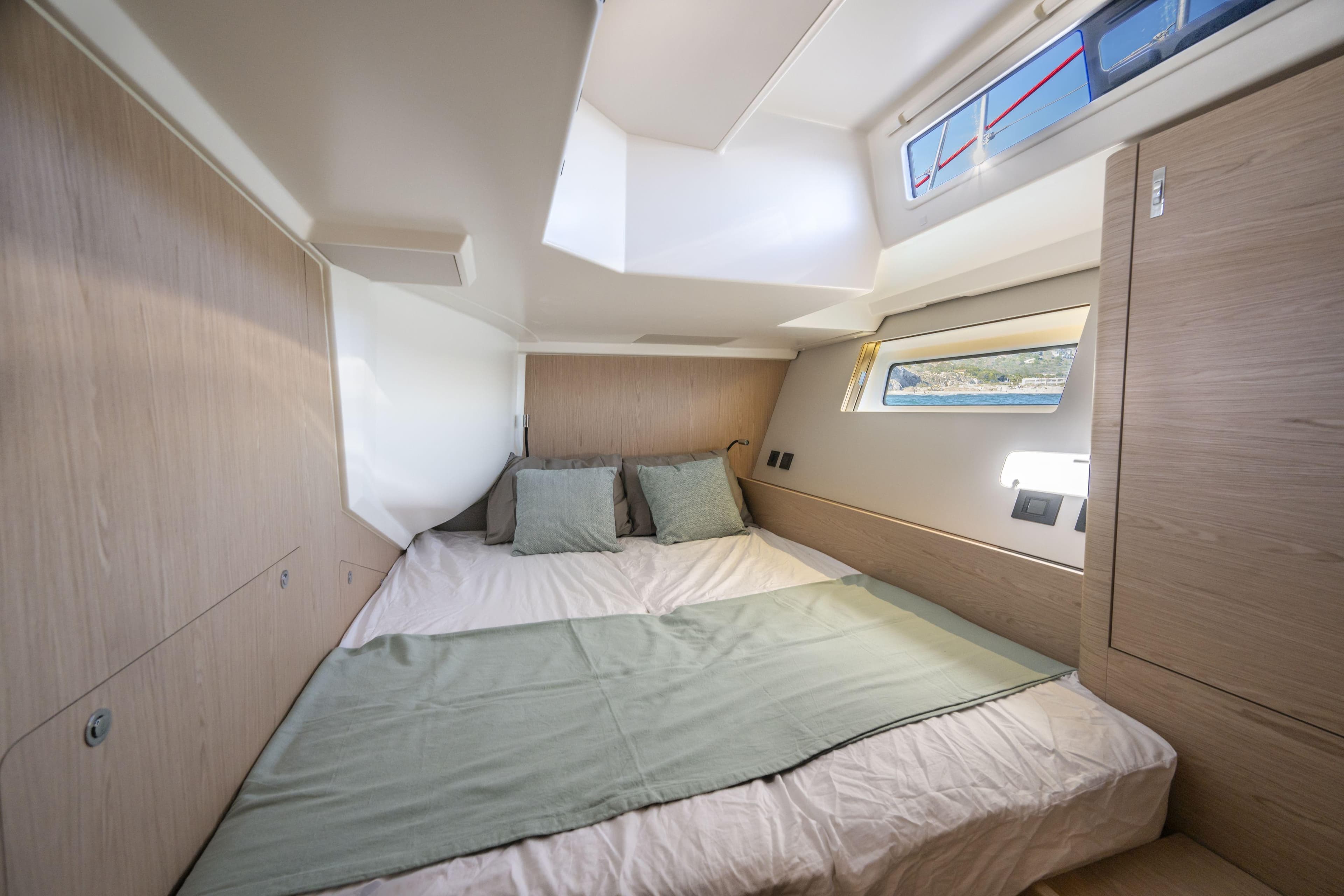 Luxurious cabin interior of 2023 Beneteau Oceanis Yacht 60 with modern design.