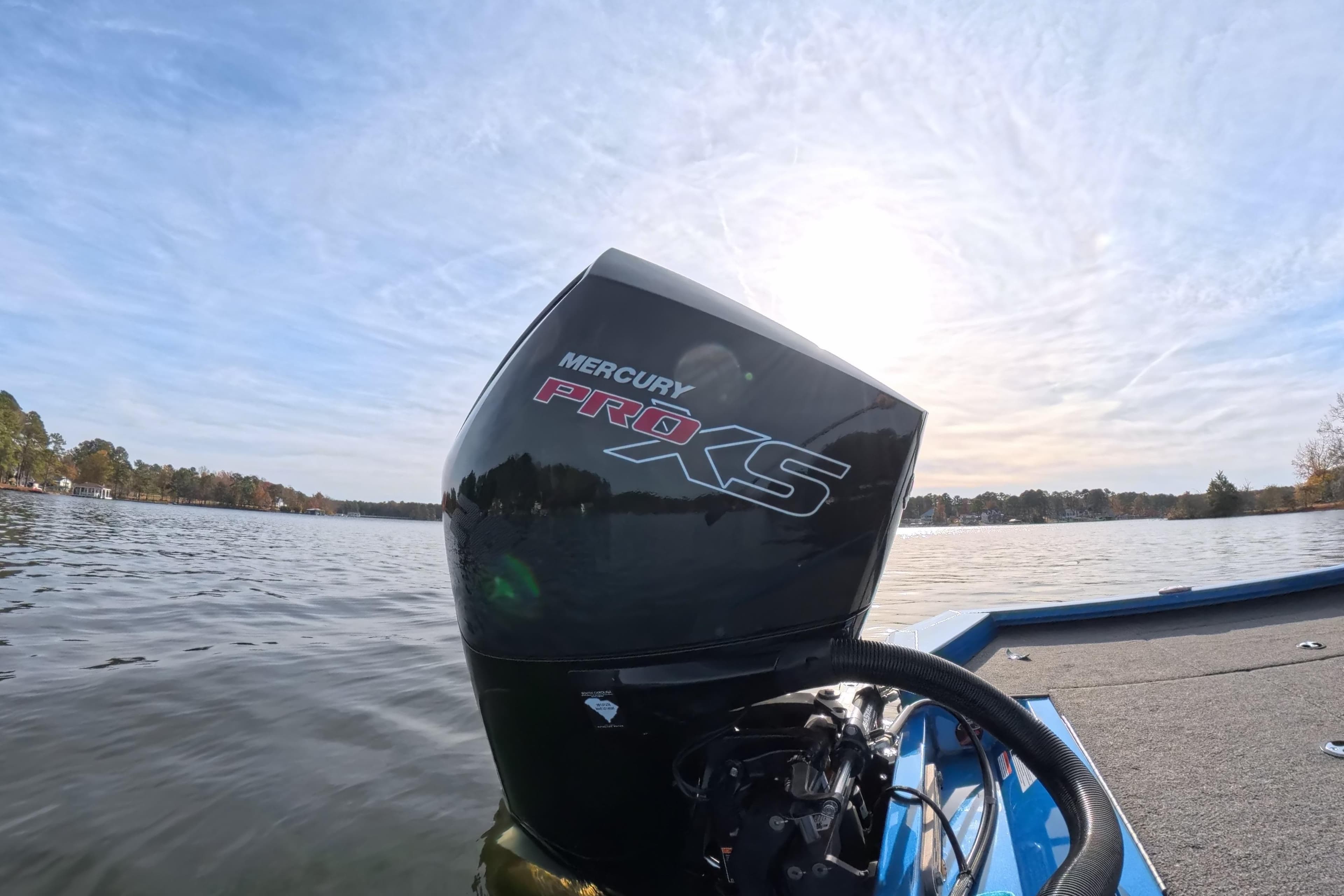 2022 Vexus AVX 2080 boat with Mercury Pro XS engine on a serene lake.
