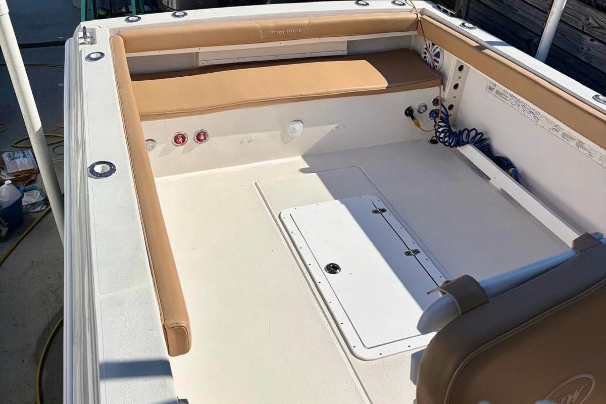 1991 Grady-White Offshore 242 boat interior with tan seating and storage compartments.