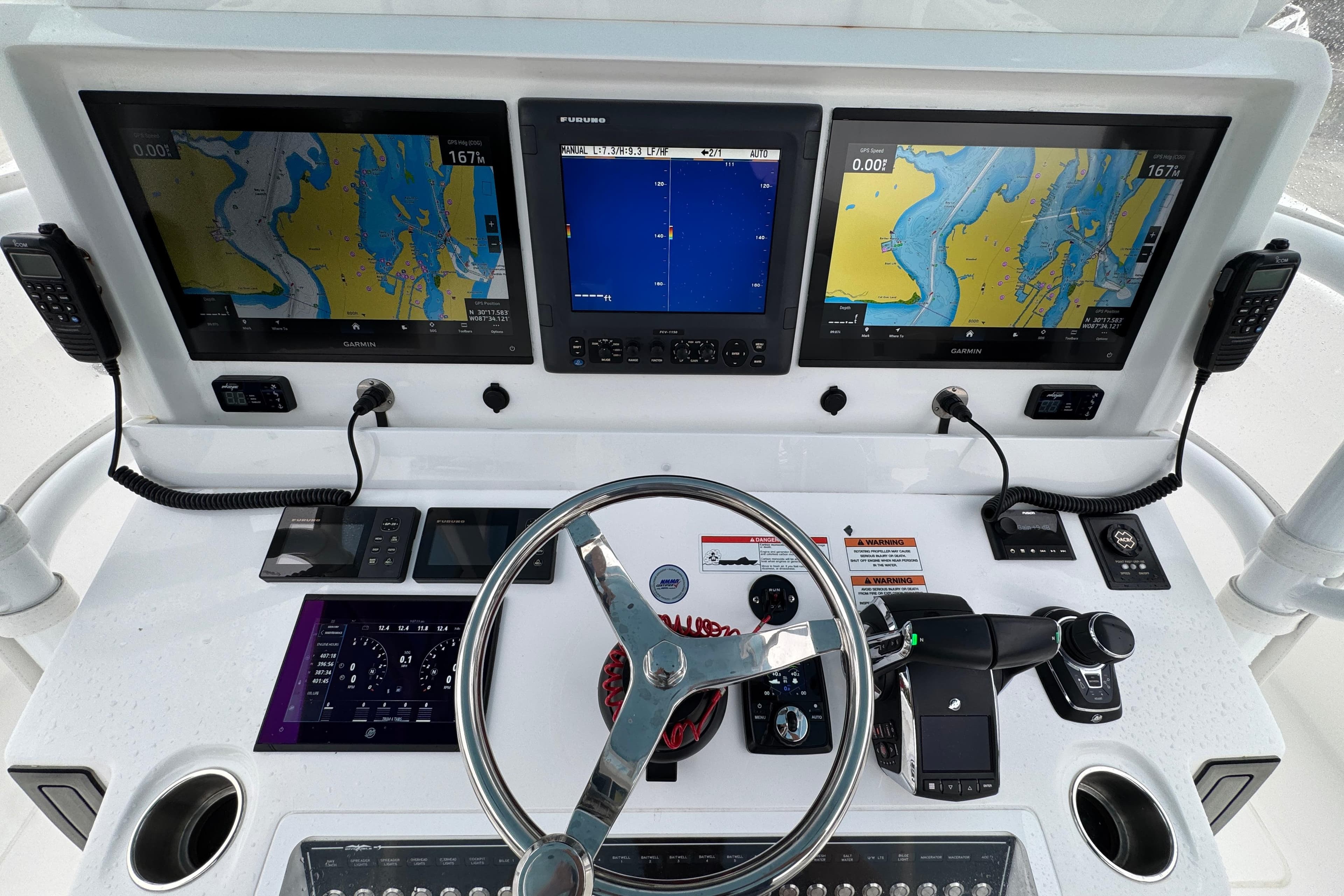 2025 Invincible 40 Catamaran helm with advanced navigation displays and controls.