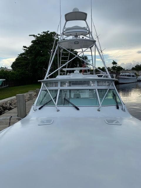 2003 Viking 50 Open yacht docked at a marina.
