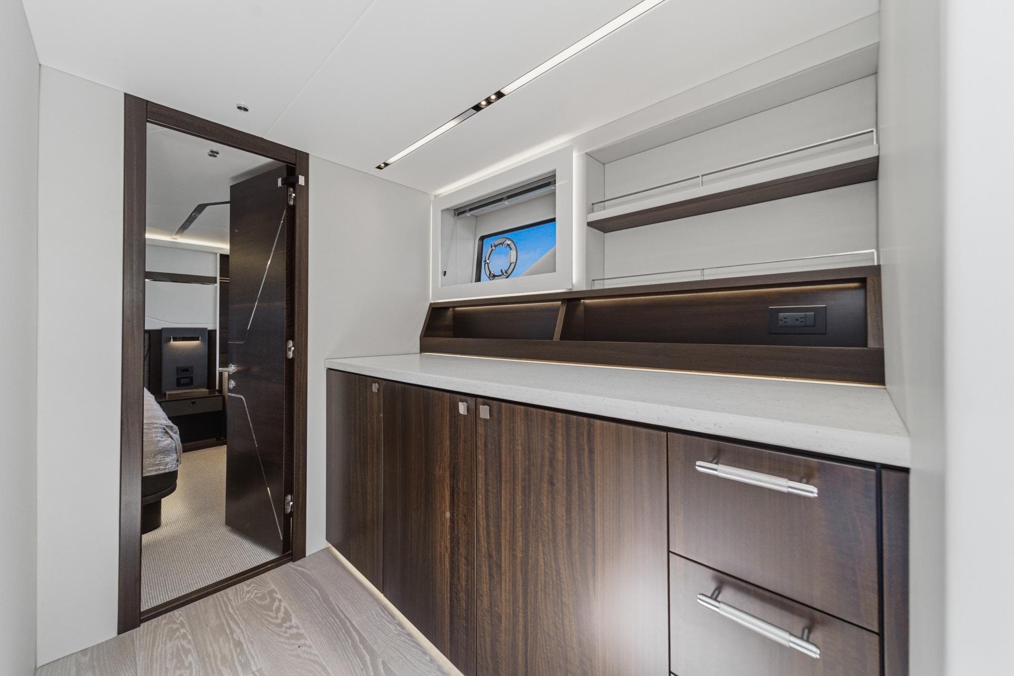 Luxurious interior of 2023 Sunseeker 65 Sport Yacht with sleek cabinetry and modern design.