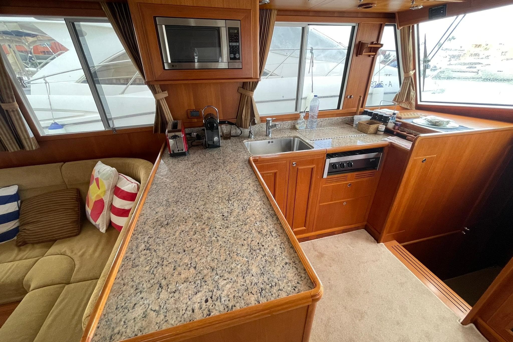 2008 Grand Banks 47 Heritage EU yacht interior with kitchen and seating area.