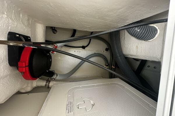 2024 Jeanneau Leader 9.0 WA engine compartment with hoses and wiring.