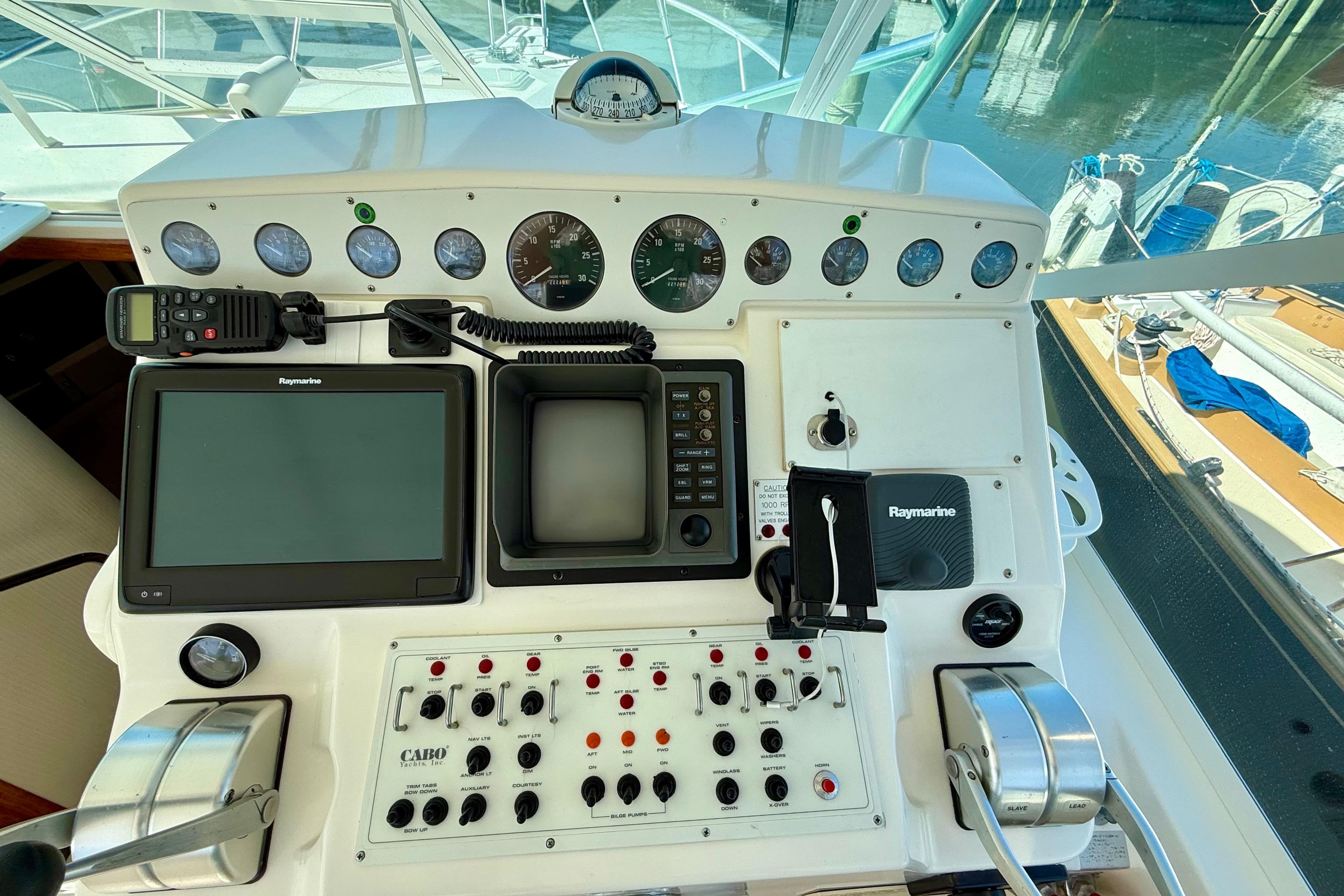 Control panel of a 2001 Cabo 35 Express boat with navigation instruments.