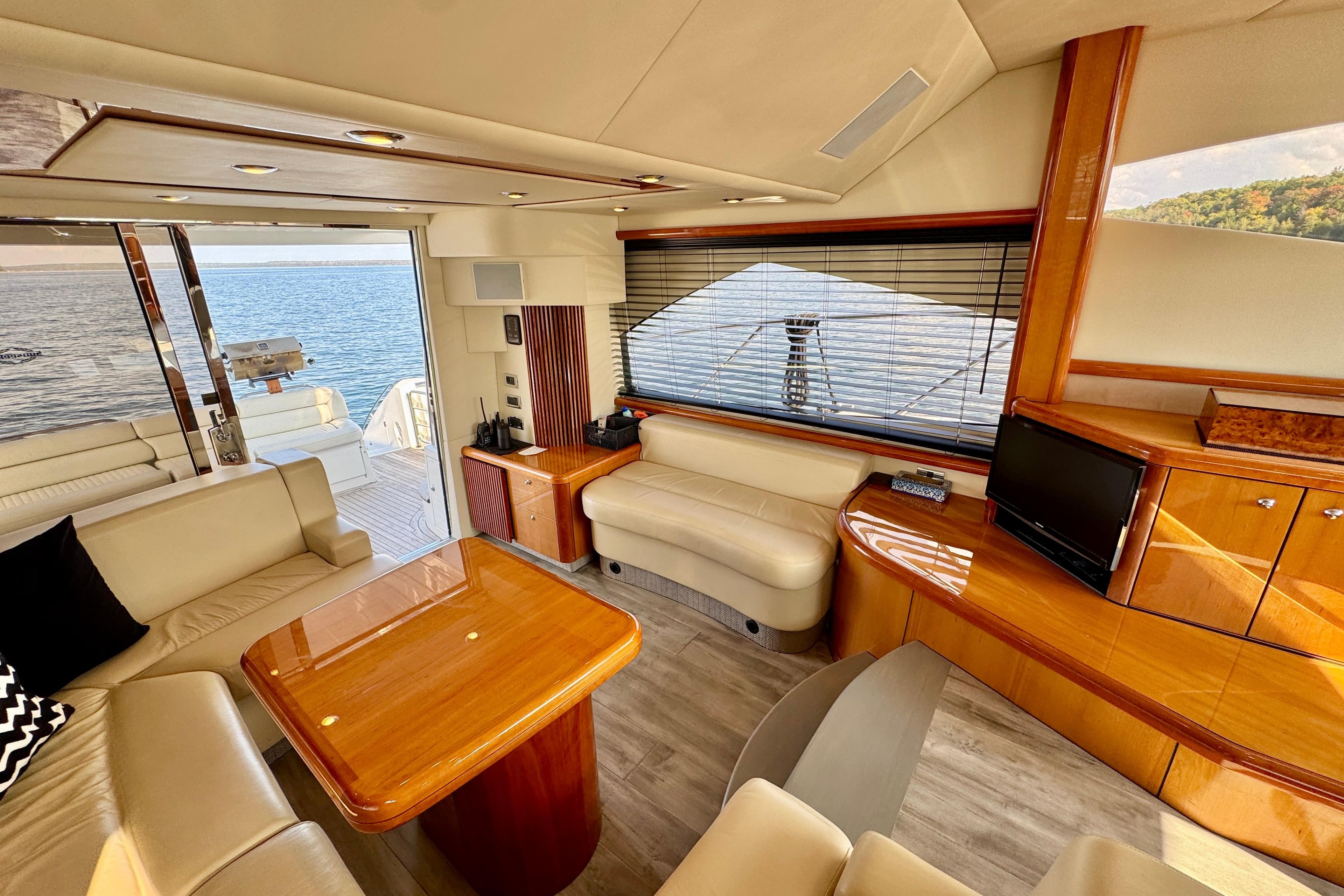 Luxurious interior of 2005 Sunseeker Manhattan 50 yacht with elegant furnishings and scenic view.