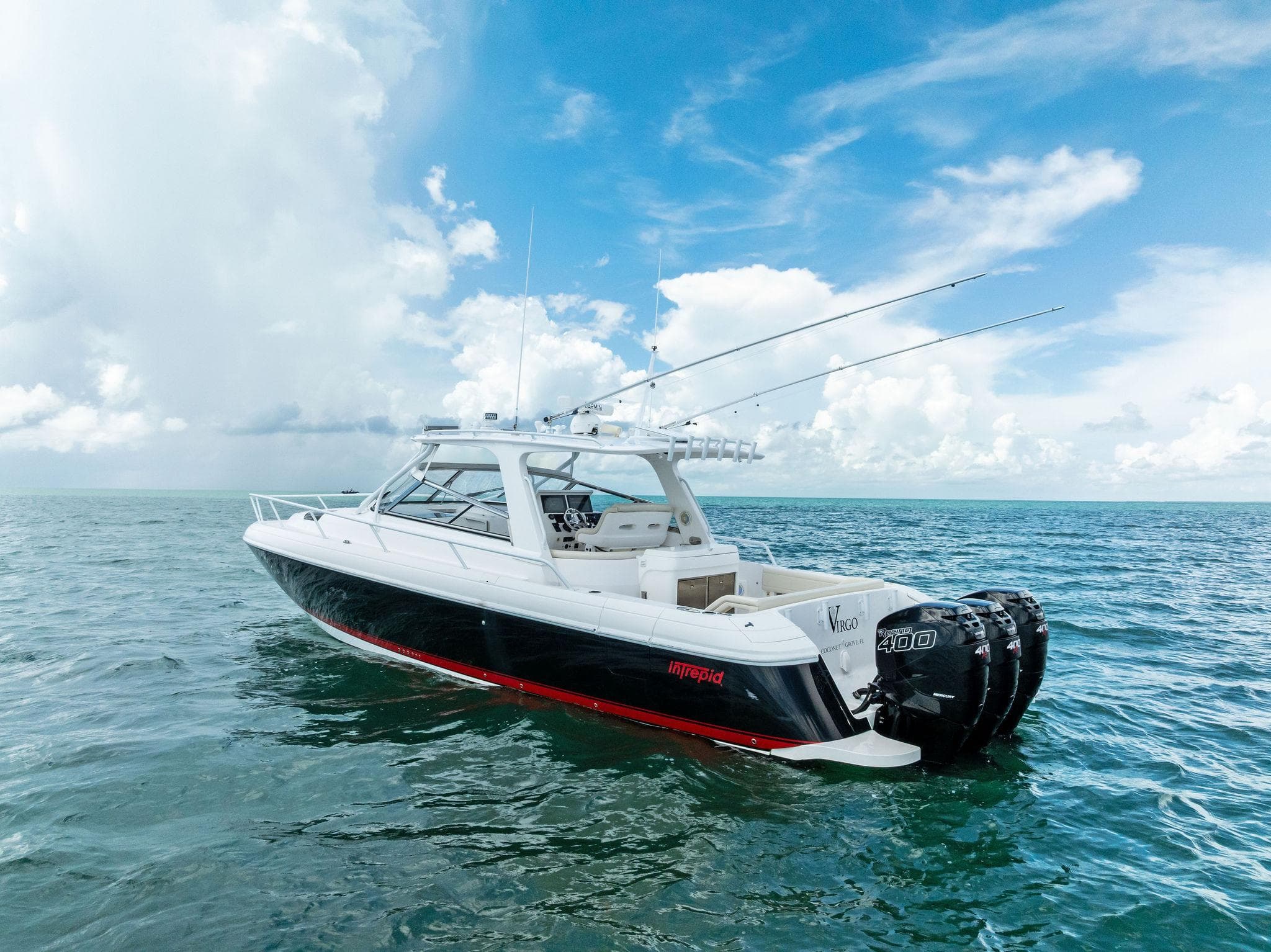 2018 Intrepid 430 Sport Yacht on open sea under blue sky.
