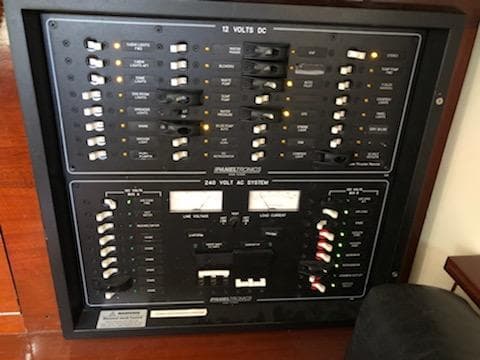 Electrical panel on a 2000 Cherubini Schooner, featuring 12V DC and 240V AC systems.