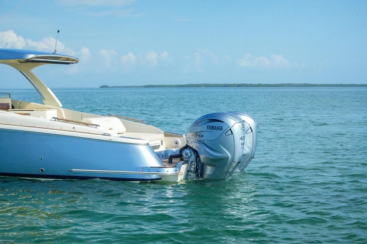 2019 Chris-Craft Launch 35 GT OB with Yamaha outboard engine on calm water.