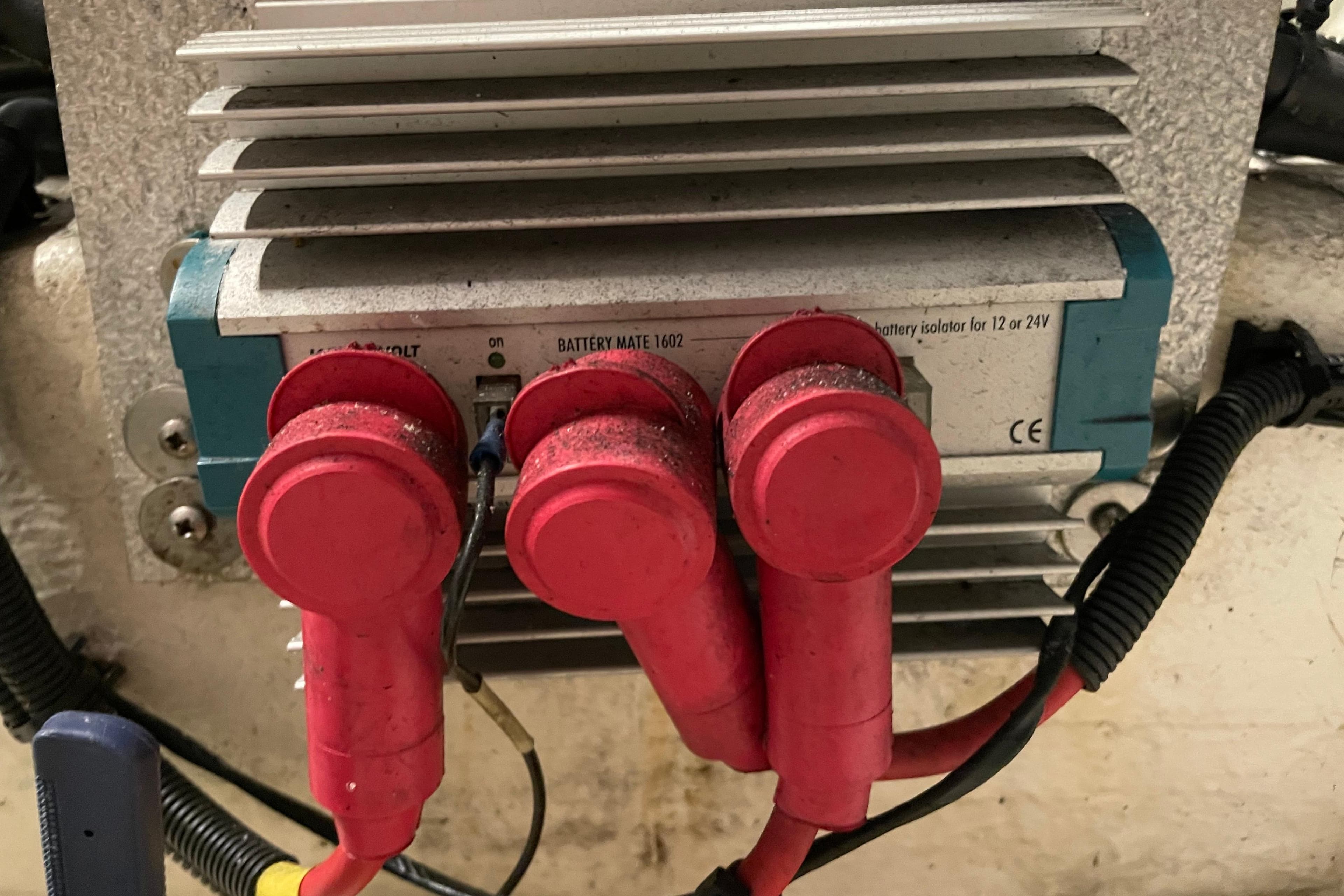 Battery isolator with red connectors on a Moody 56, 2004 model.