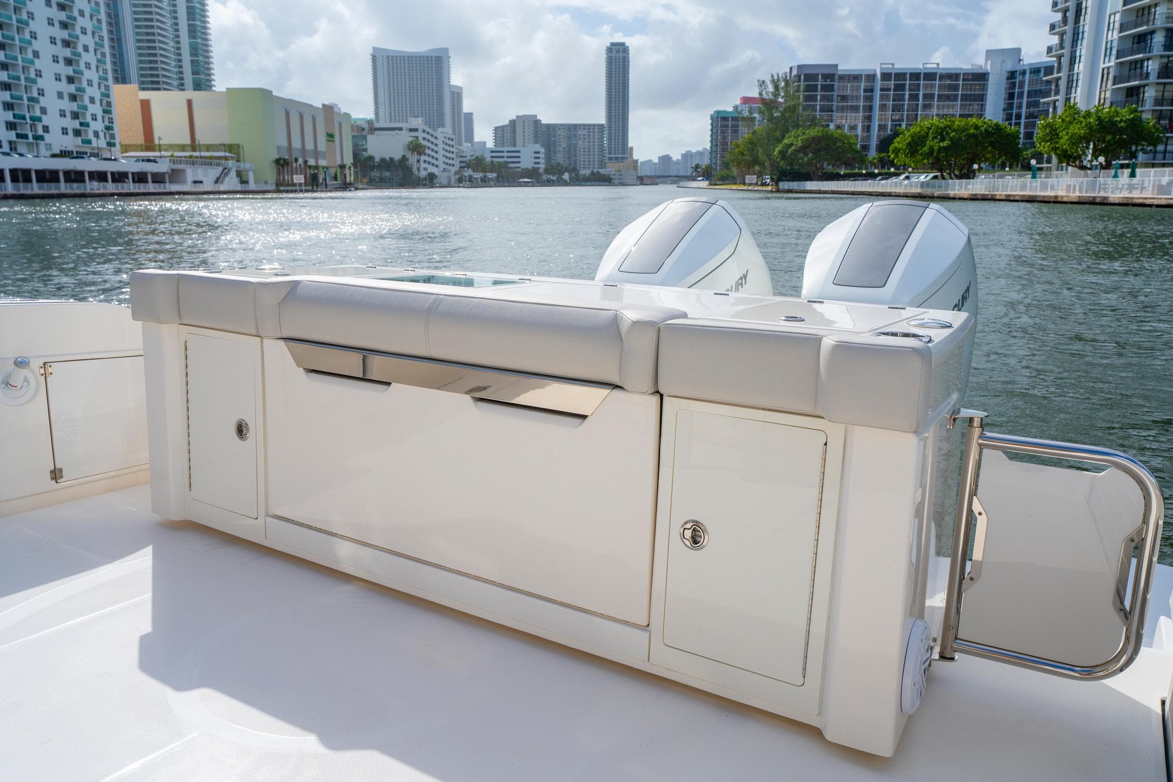 2024 Tiara Yachts 43 LS boat with dual engines, docked in a city marina.